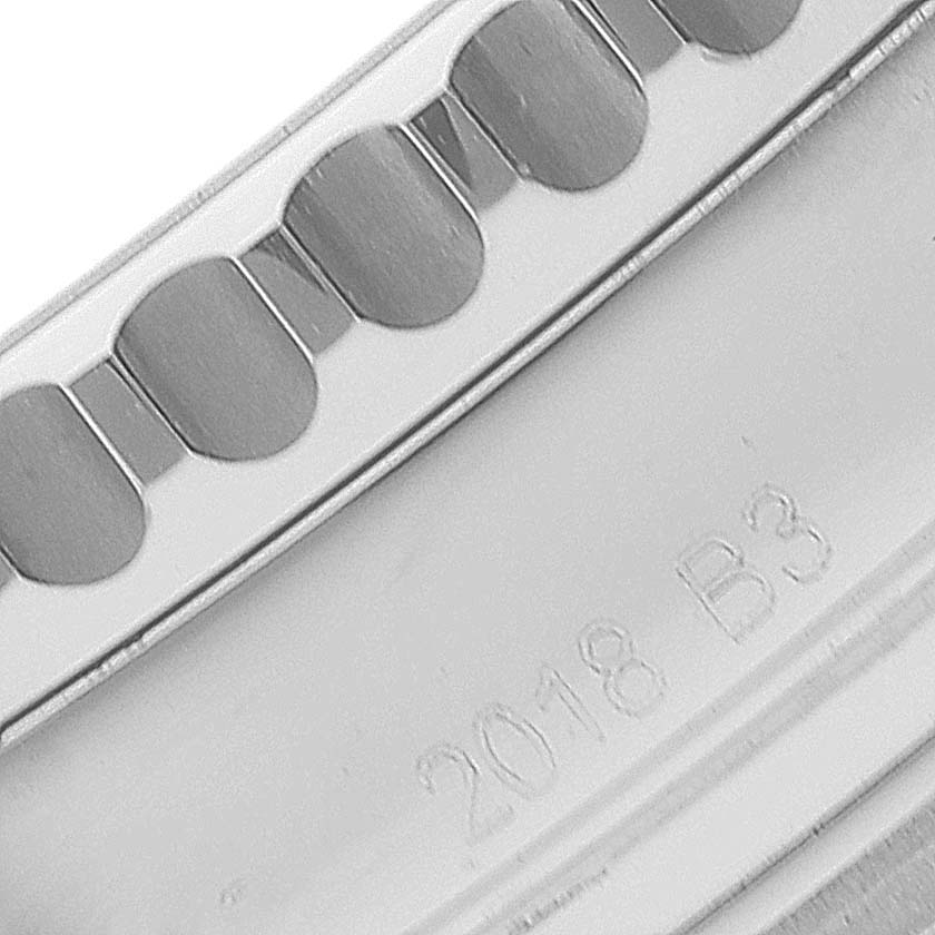 This is a close-up image of the bezel, side, and case markings of a Breitling Navitimer AB0121 Men
s Stainless Steel Blue Dial AB0121 Men
s Stainless Steel Blue Dial watch, showing intricate details and engravings.