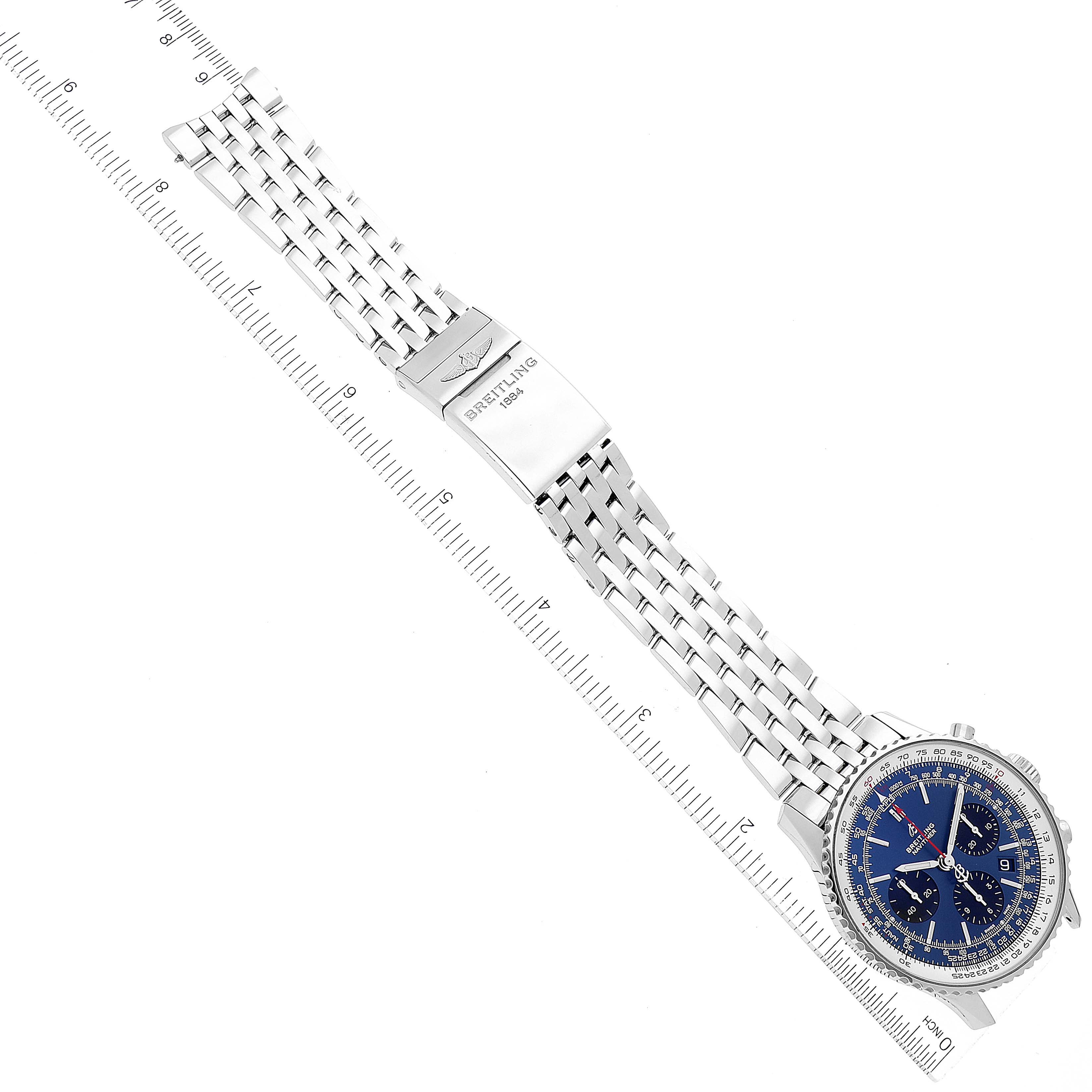 The image shows a top-down view of a Breitling Navitimer AB0121 Men
s Stainless Steel Blue Dial AB0121 Men
s Stainless Steel Blue Dial watch, focusing on its blue dial, silver case, and metal bracelet.