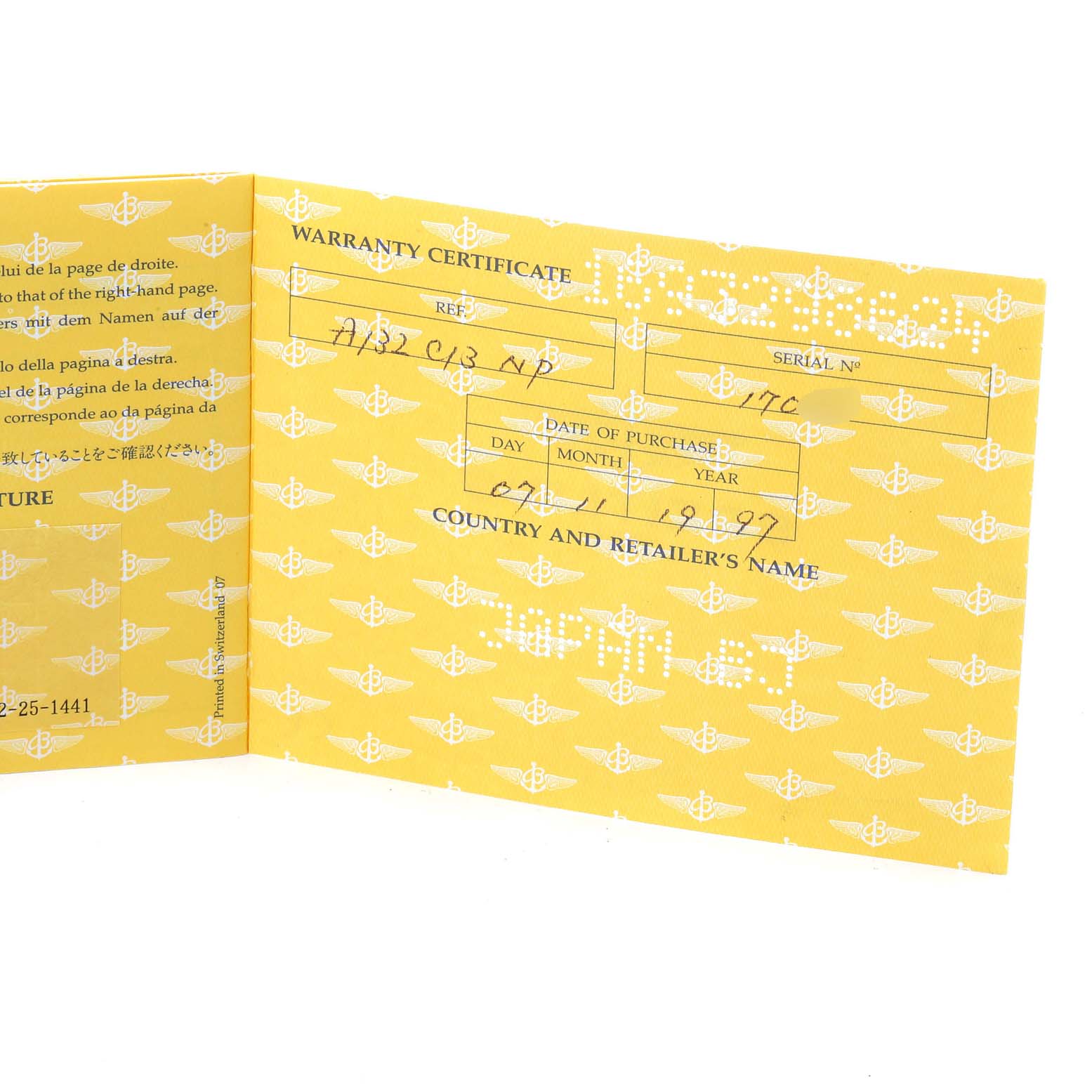 The image shows an open Breitling Navitimer A13022 Men
s Stainless Steel Blue Dial A13022 Men
s Stainless Steel Blue Dial warranty certificate with handwritten details.