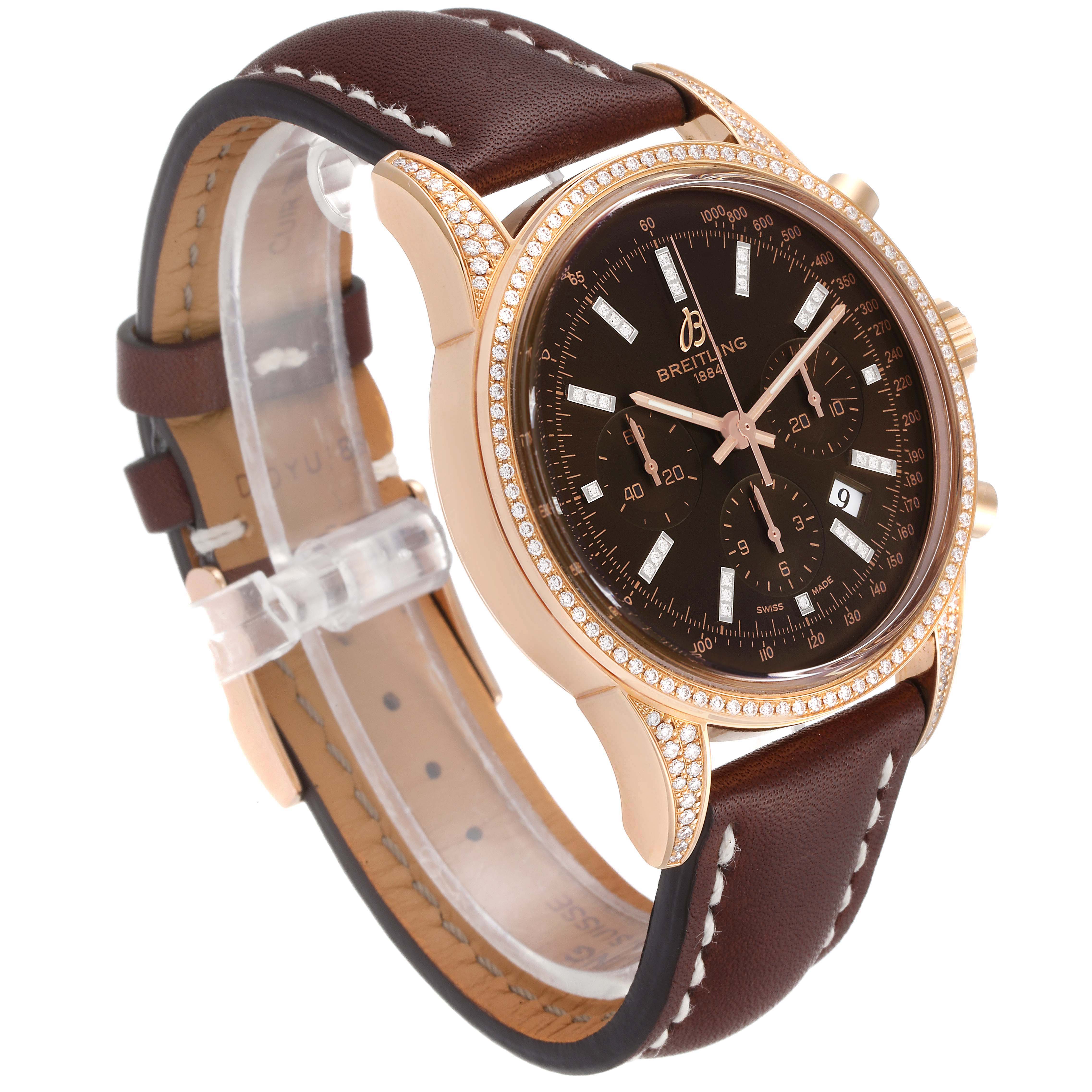 The Breitling Transocean RB0152 Men's Rose Gold Brown Dial RB0152 Men's Rose Gold Brown Dial watch is shown from a side angle, highlighting the brown leather strap, diamond-studded bezel, and black dial.