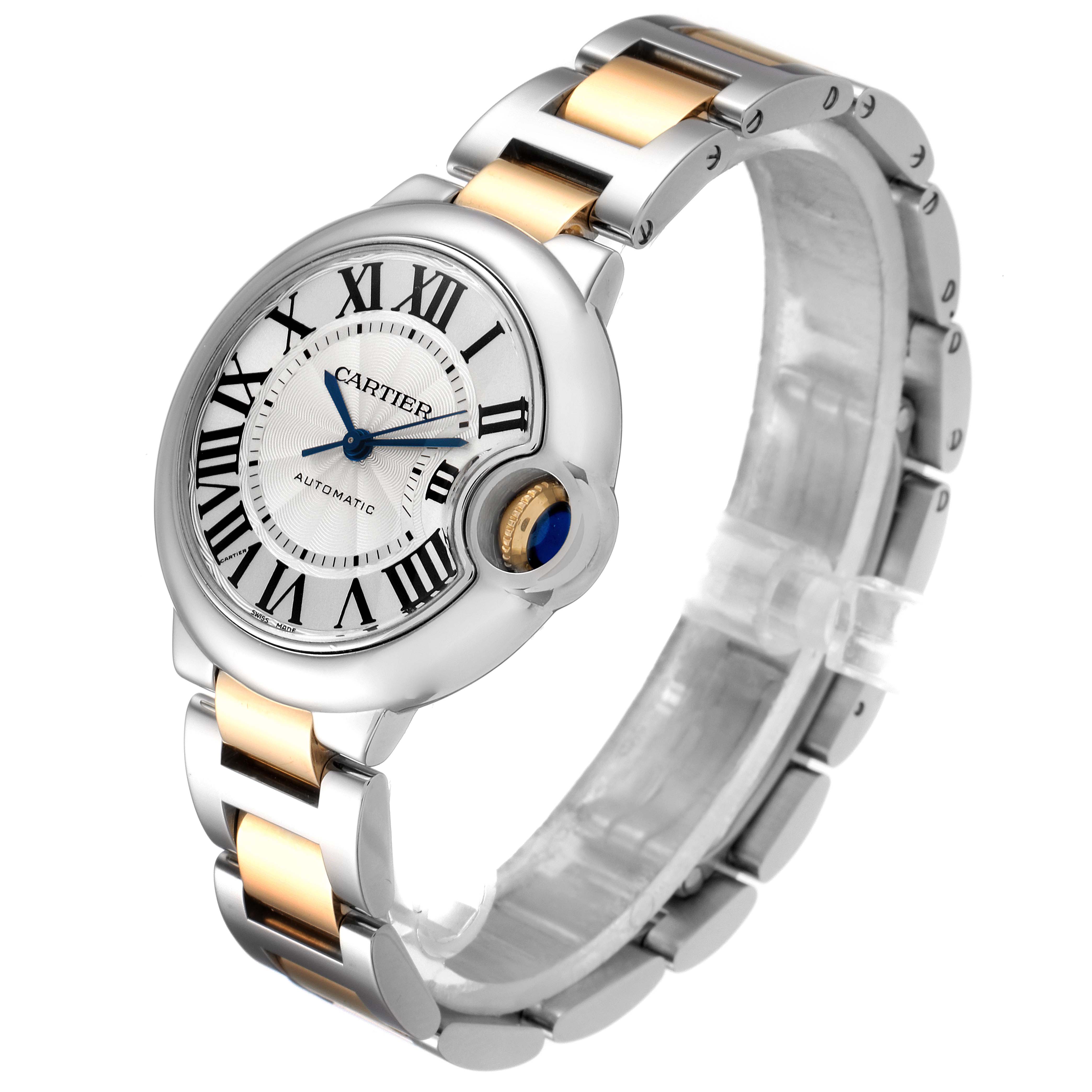 The image showcases a side and front angle of the Cartier Ballon Bleu W2BB0002 Women
s Steel and Gold (two tone) Silver Dial W2BB0002 Women
s Steel and Gold (two tone) Silver Dial watch, highlighting its round face, Roman numerals, and two-tone bracelet.