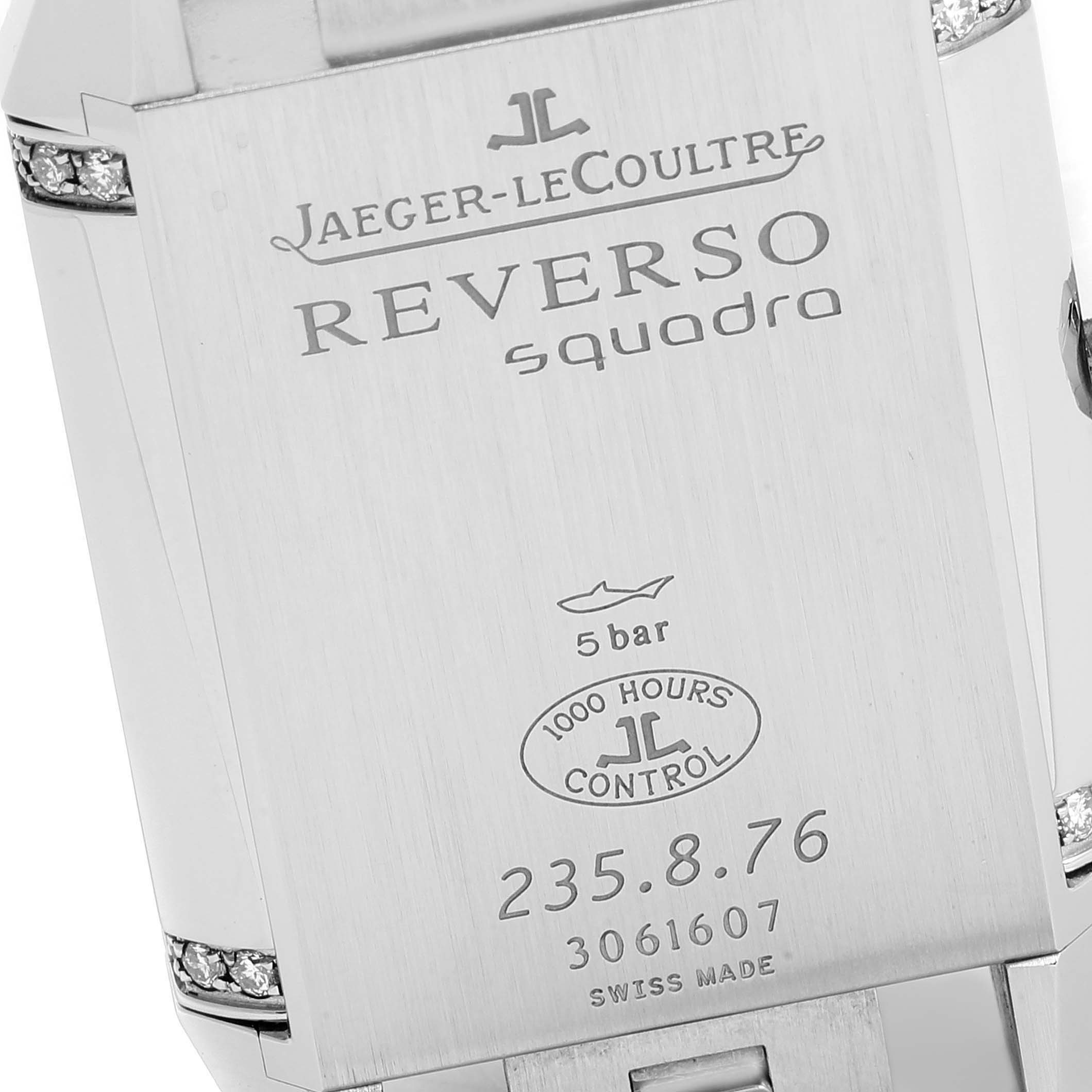 This image shows the back case of a Jaeger-LeCoultre Reverso Squadra watch, highlighting branding and model details.