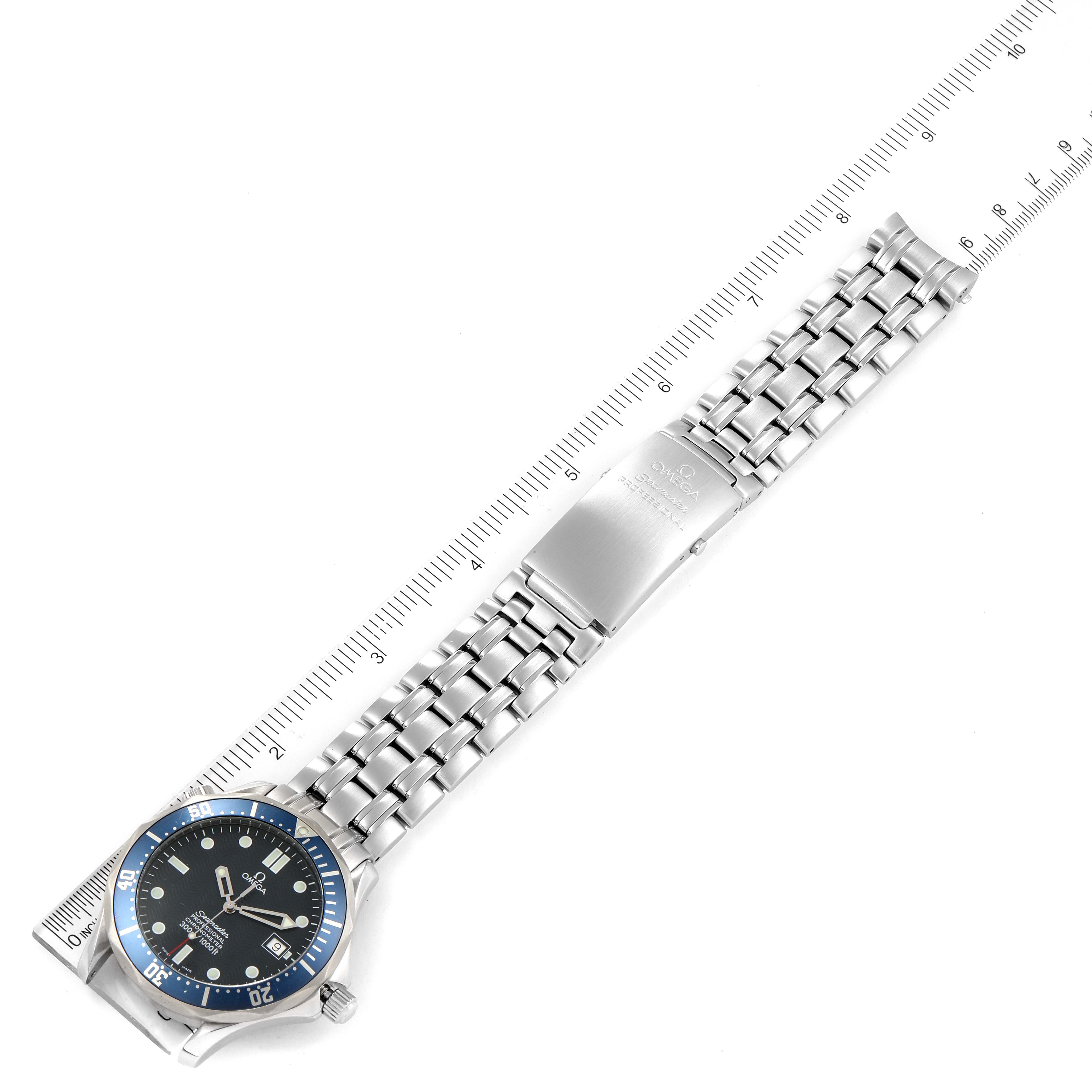 The image shows an Omega Seamaster 2531.80.00 Men's Stainless Steel Blue Dial 2531.80.00 Men's Stainless Steel Blue Dial watch laid flat with a ruler beside it, displaying the watch face, bezel, and metal bracelet.