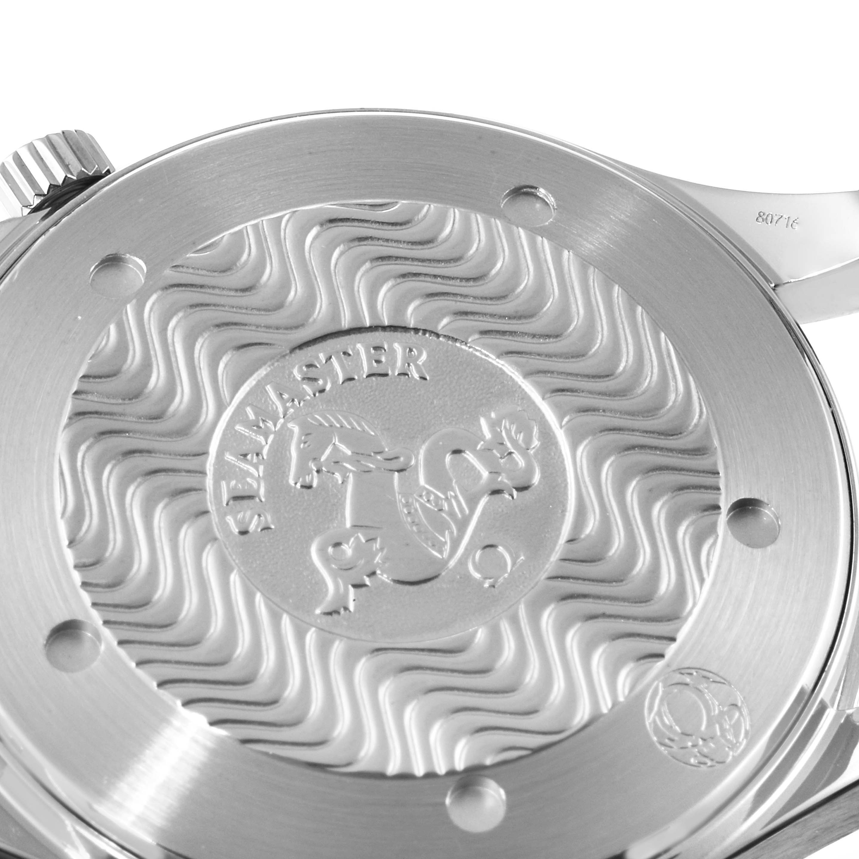 The image shows a close-up view of the case back of an Omega Seamaster 2531.80.00 Men's Stainless Steel Blue Dial 2531.80.00 Men's Stainless Steel Blue Dial watch, highlighting its engravings and wave pattern.