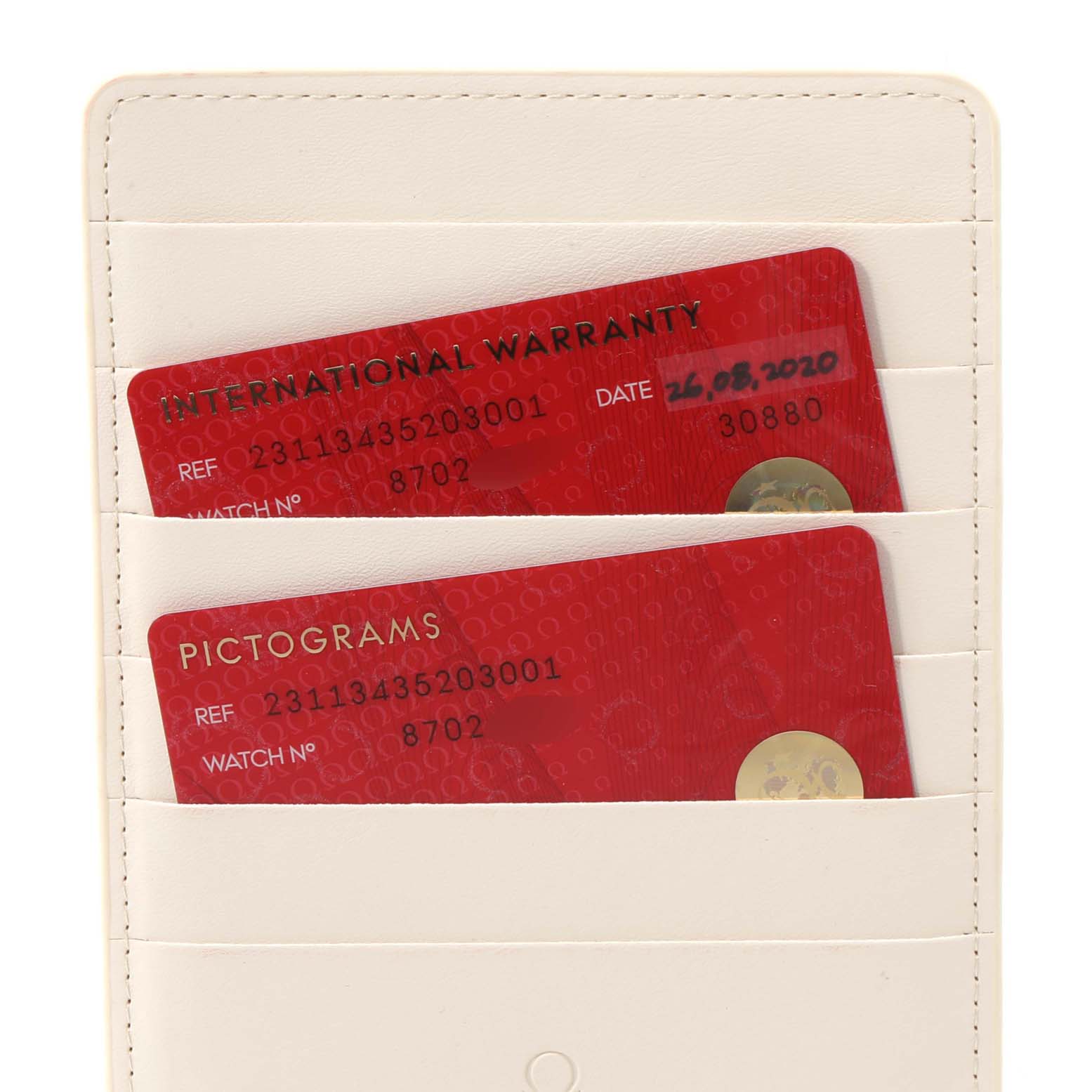 The image shows international warranty and pictogram cards for an Omega Aqua Terra 231.13.43.52.03.001 Men
s Stainless Steel Blue Dial 231.13.43.52.03.001 Men
s Stainless Steel Blue Dial watch, held in a white cardholder.