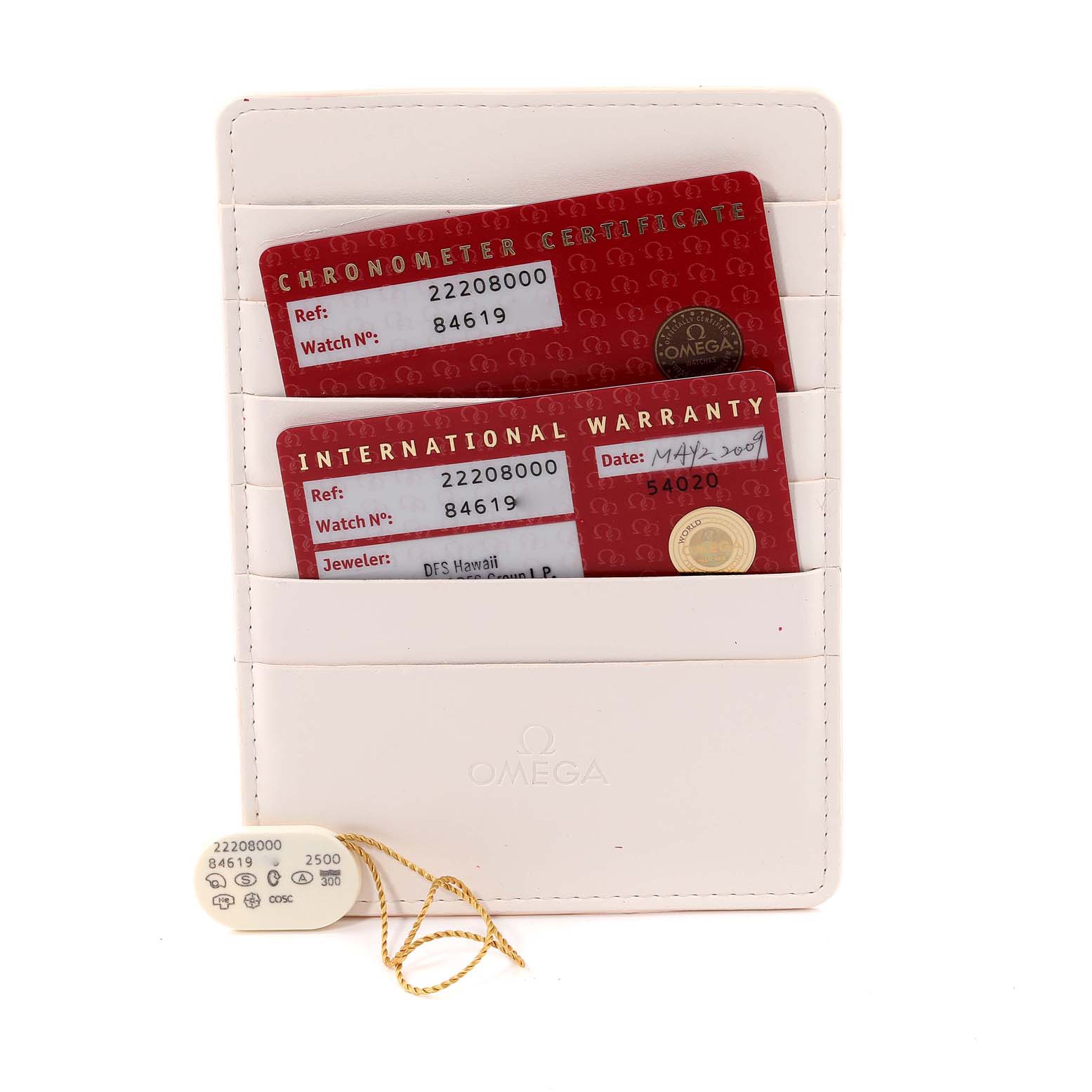 This image shows the warranty cards and hang tag for an Omega Seamaster 2220.80.00 Men's Stainless Steel Blue Dial 2220.80.00 Men's Stainless Steel Blue Dial watch, placed in a white cardholder.