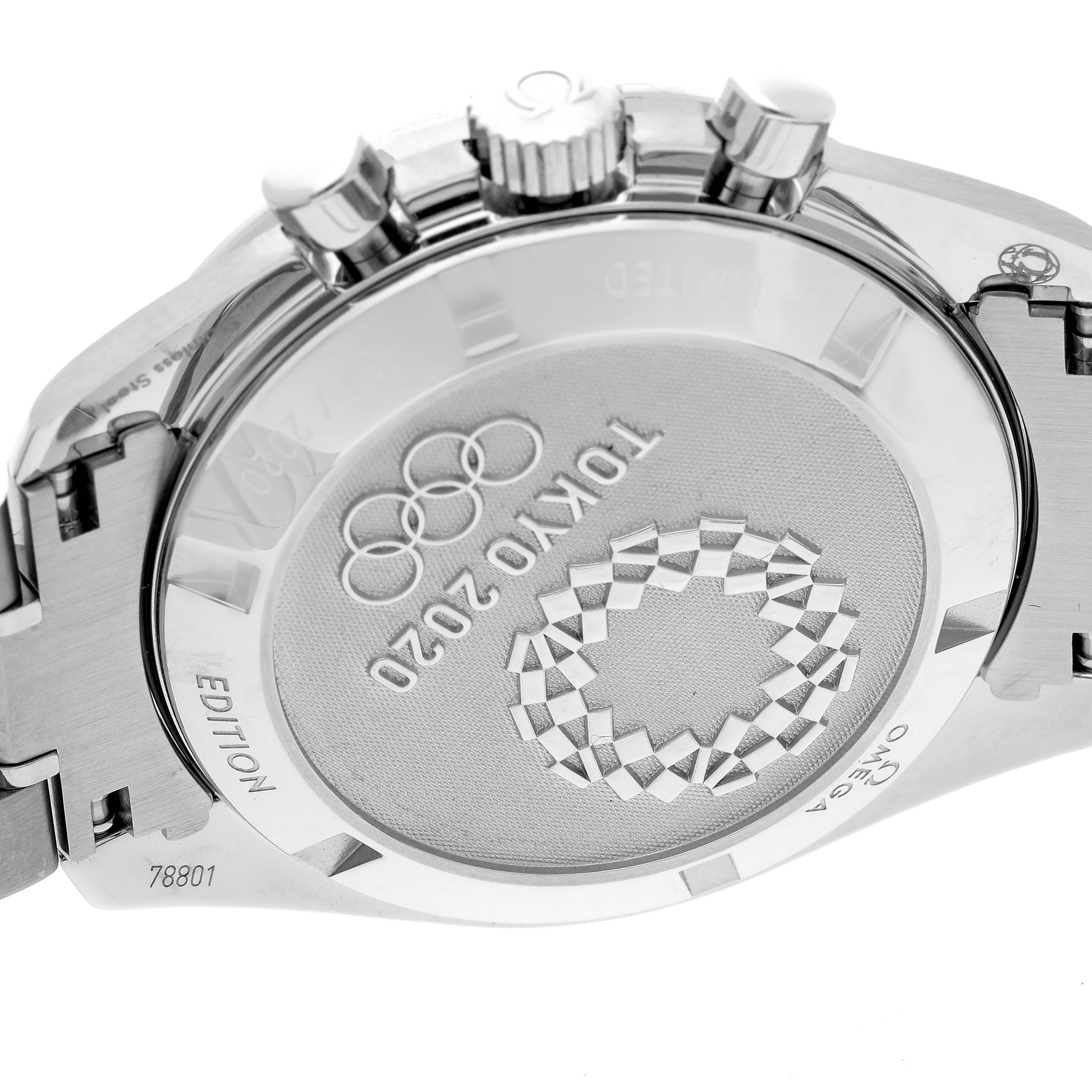 The image shows the case back of an Omega Speedmaster 522.30.42.30.06.001 Men
s Stainless Steel Silver Dial 522.30.42.30.06.001 Men
s Stainless Steel Silver Dial watch, highlighting the "Tokyo 2020" engraving and Olympic rings.