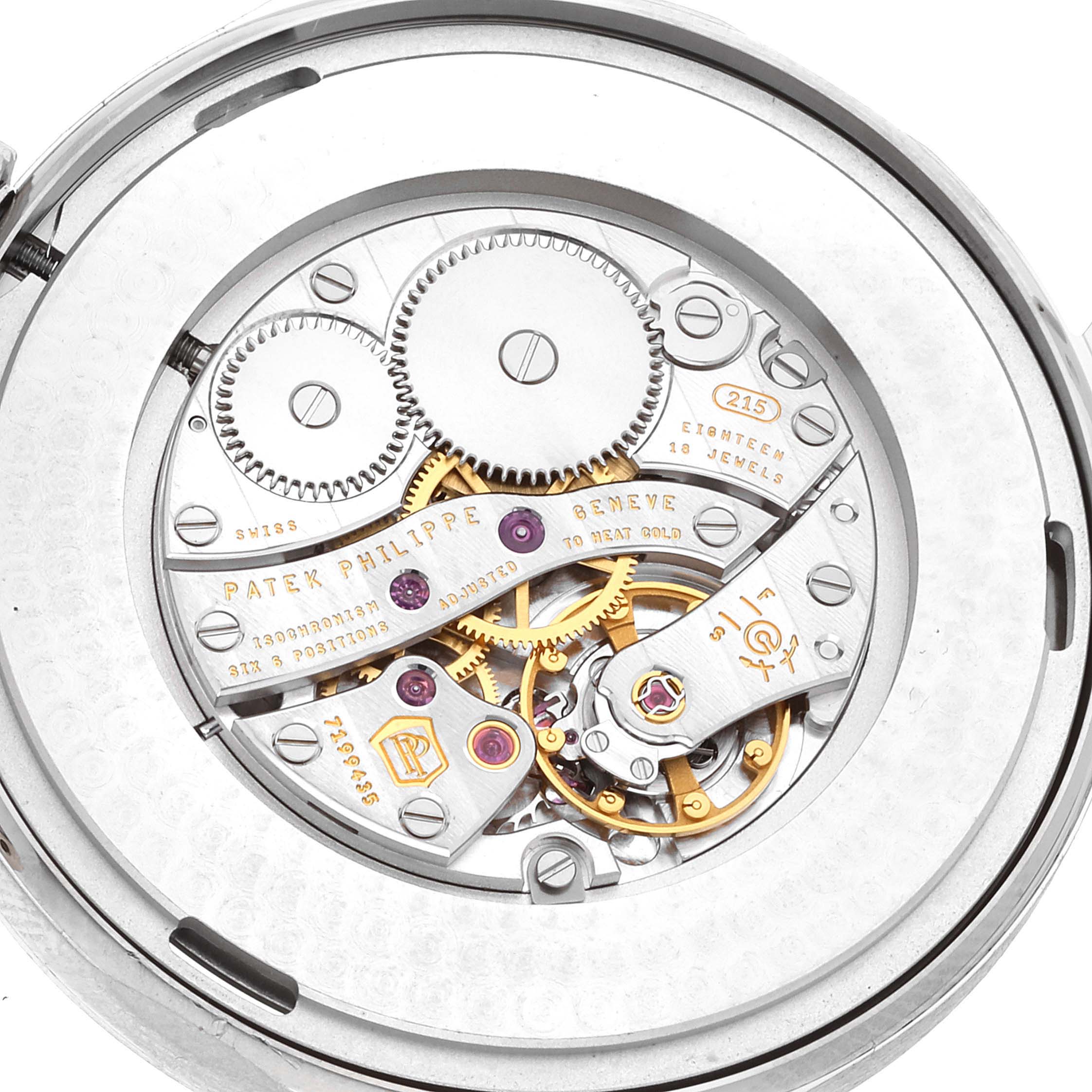The image shows the intricate inner mechanism of a Patek Philippe Calatrava 5196G Men
s White Gold Silver Dial 5196G Men
s White Gold Silver Dial watch from a back angle.