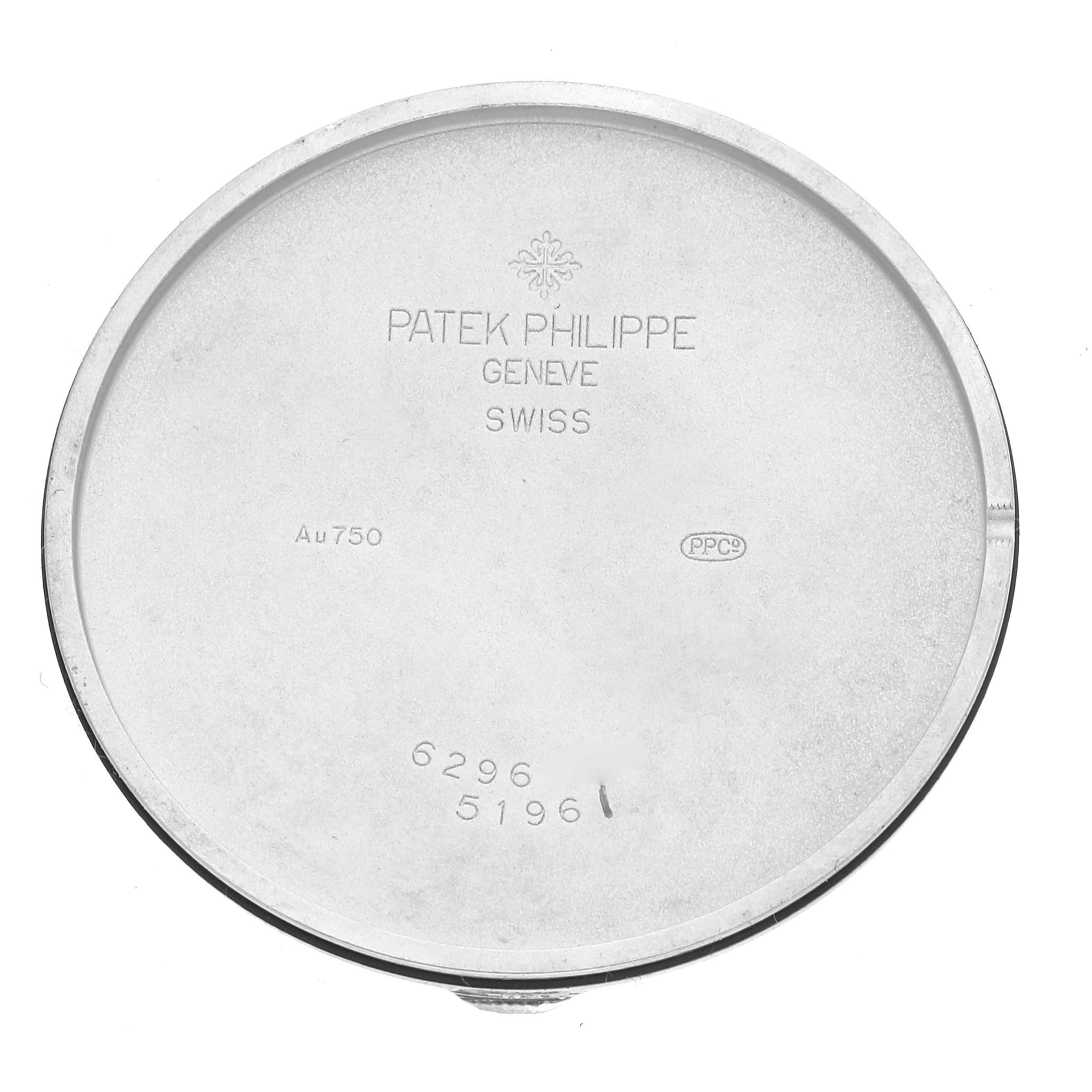 This image shows the inner case back of a Patek Philippe Calatrava 5196G Men
s White Gold Silver Dial 5196G Men
s White Gold Silver Dial watch, engraved with various markings.