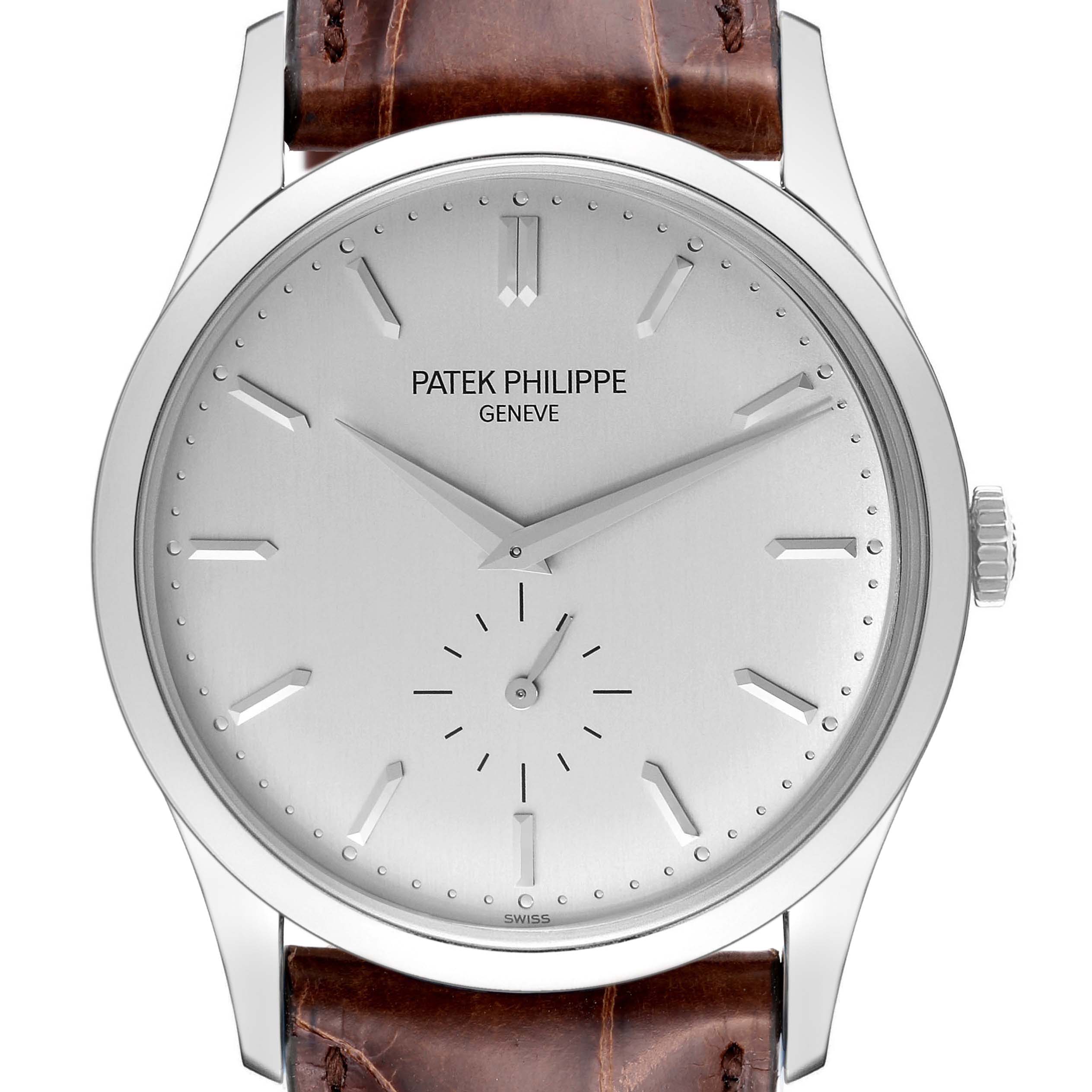 The image shows a frontal view of a Patek Philippe Calatrava 5196G Men
s White Gold Silver Dial 5196G Men
s White Gold Silver Dial watch with a silver dial and brown leather strap.