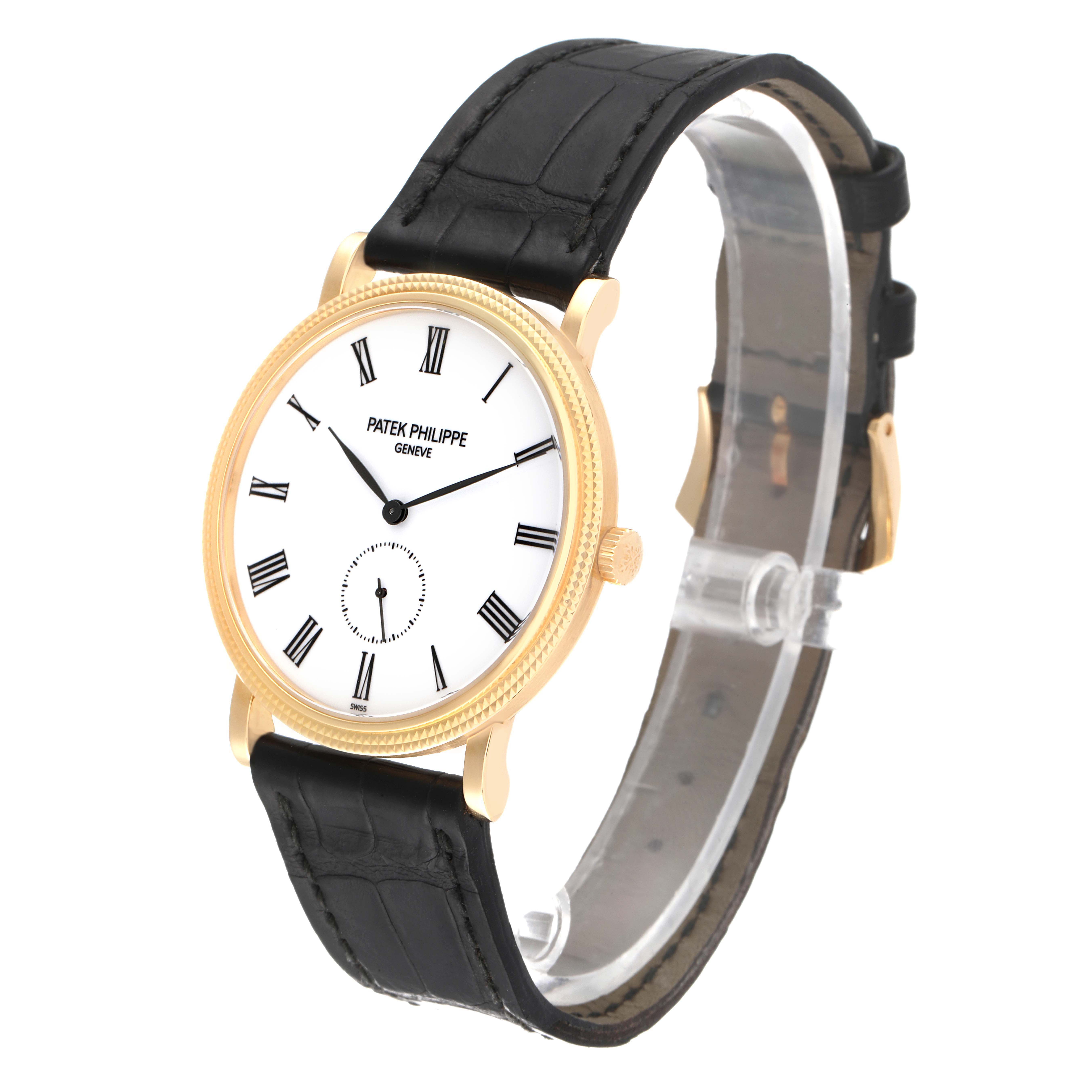 The image shows a Patek Philippe Calatrava 5119J-001 Men's Yellow Gold White Dial 5119J-001 Men's Yellow Gold White Dial watch from an angled side view, highlighting its black strap, white dial, and gold case.