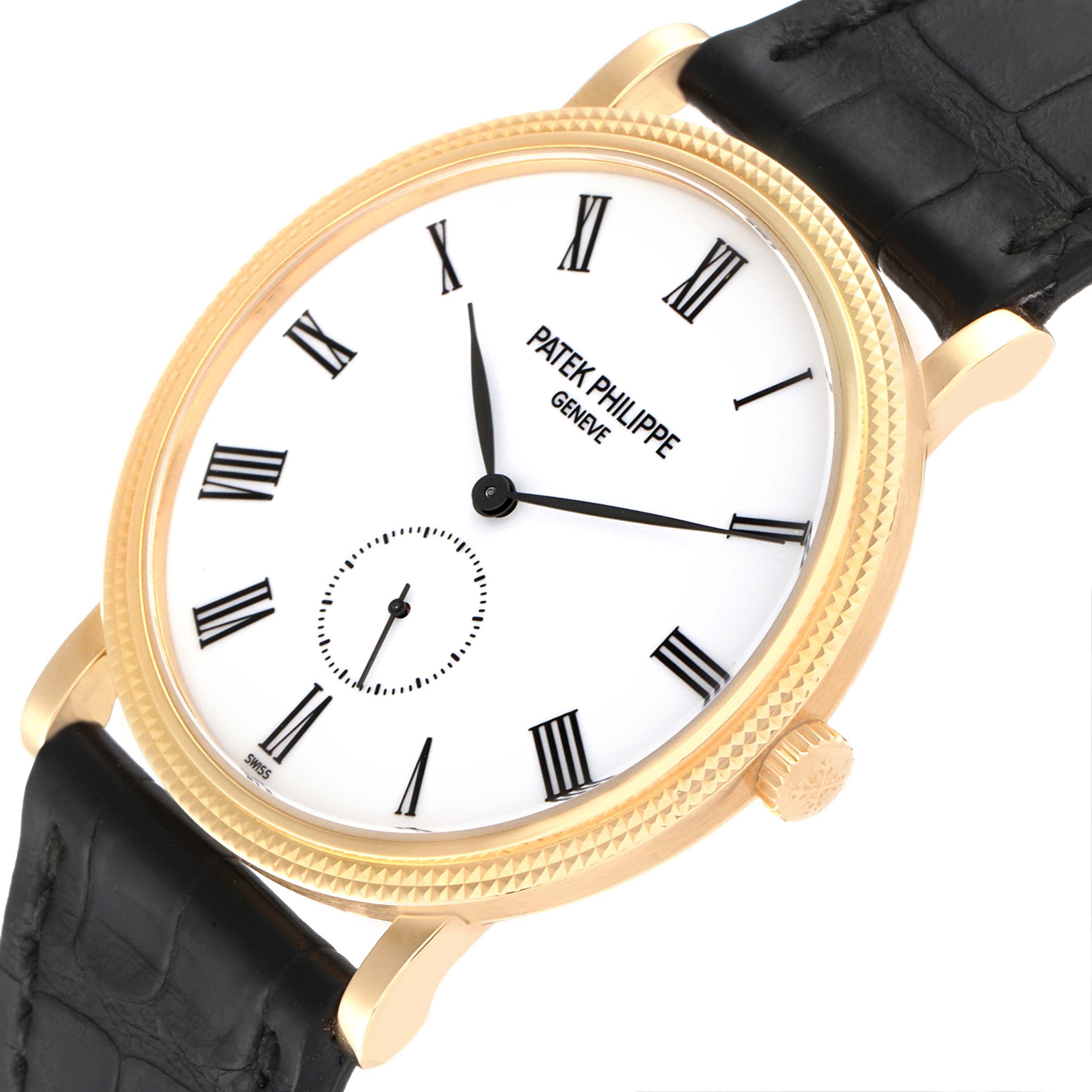 This image shows a top-front angled view of a Patek Philippe Calatrava 5119J-001 Men's Yellow Gold White Dial 5119J-001 Men's Yellow Gold White Dial watch, featuring its face, hands, crown, Roman numerals, and partial strap.