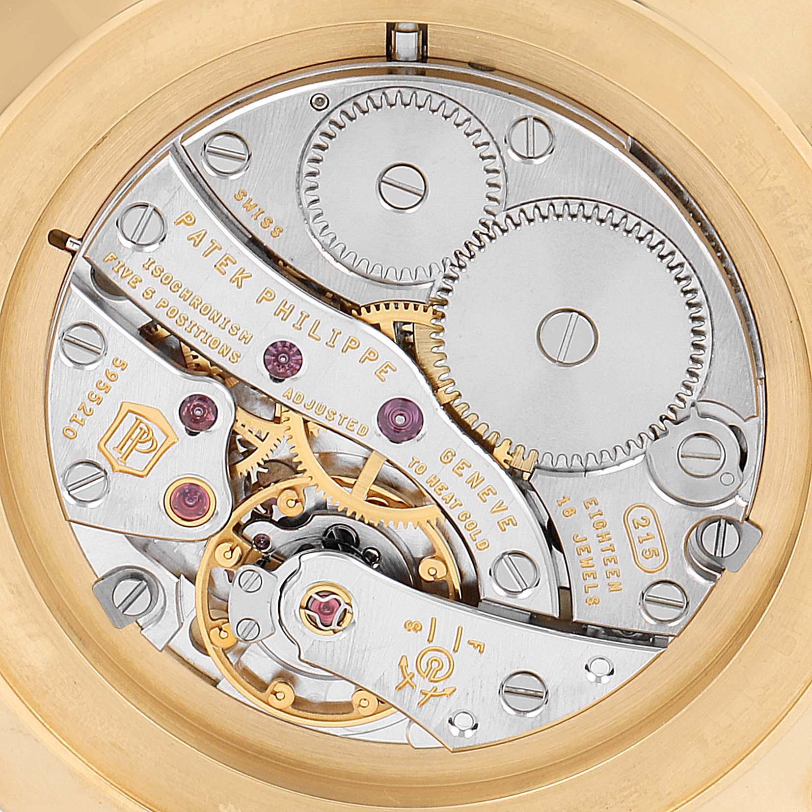 The image shows the back view of a Patek Philippe Calatrava 5119J-001 Men's Yellow Gold White Dial 5119J-001 Men's Yellow Gold White Dial watch, highlighting its intricate mechanical movement.