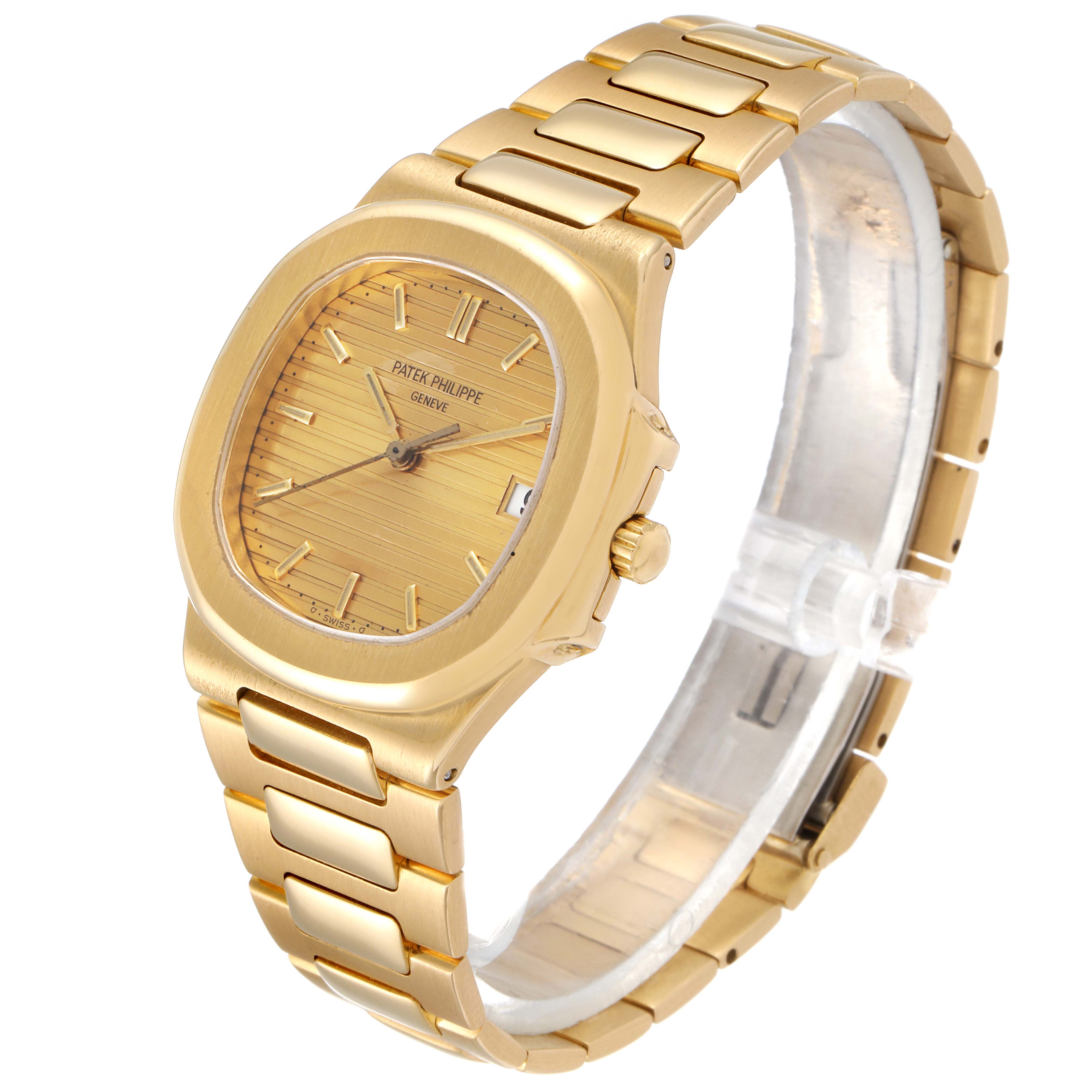 The image shows a Patek Philippe Nautilus 3900/1J Women's Yellow Gold Champagne Dial 3900/1J Women's Yellow Gold Champagne Dial watch, angled to display its gold case, dial, and bracelet.