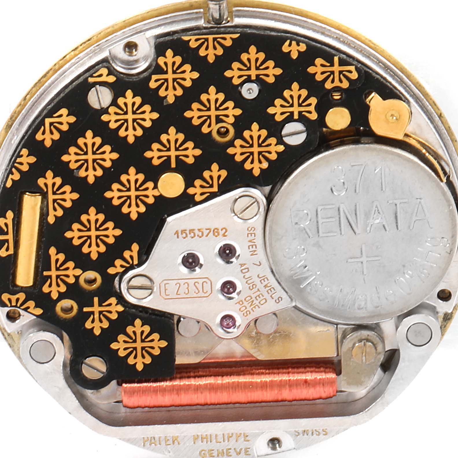 This image shows the internal mechanism of a Patek Philippe Nautilus 3900/1J Women's Yellow Gold Champagne Dial 3900/1J Women's Yellow Gold Champagne Dial watch, focusing on the movement and battery components.