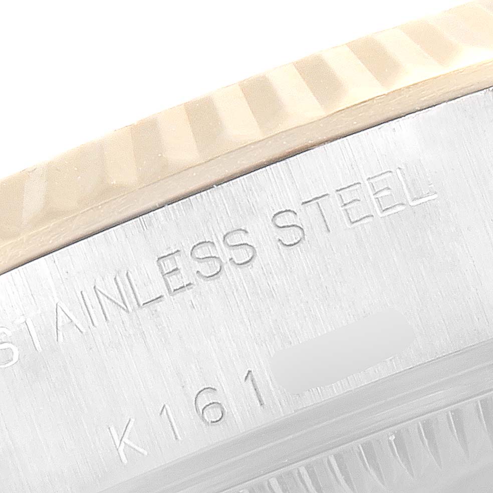 This image shows a close-up of the side of a Rolex Datejust 79173 Women's Steel and Gold (two tone) White Dial 79173 Women's Steel and Gold (two tone) White Dial watch, highlighting its stainless steel casing and part of the bezel.