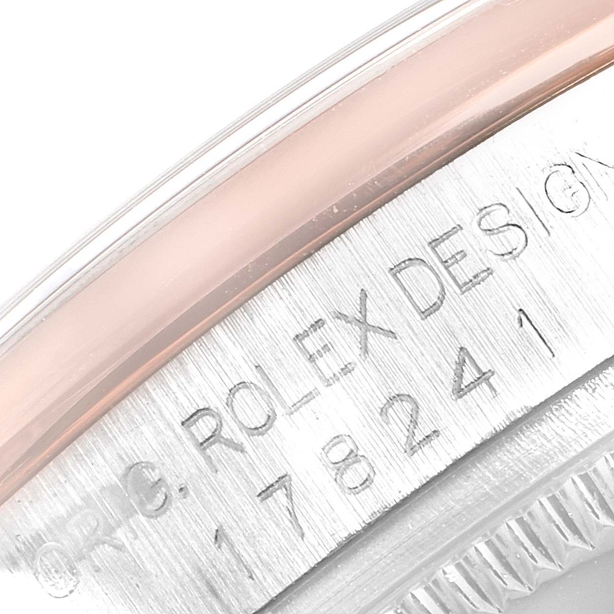 This image shows a close-up of the case edge and serial number of a Rolex Mid-Size 178241 Women
s Steel and Gold (two tone) White Dial 178241 Women
s Steel and Gold (two tone) White Dial model watch.