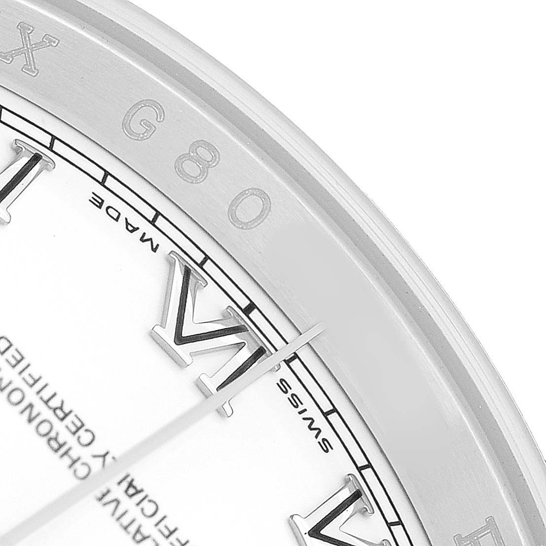 The image displays a close-up of the Rolex Datejust 116200 Men's Stainless Steel White Dial watch's dial, focusing on the Roman numerals and inner rim.