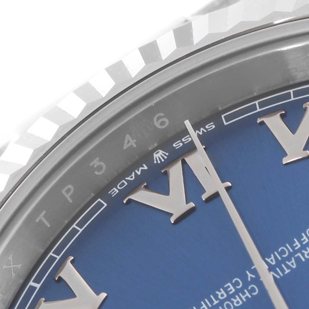 Close-up of the Rolex Datejust 41 126334 Men's Stainless Steel Blue Dial 126334 Men's Stainless Steel Blue Dial watch showing part of the blue dial, Roman numeral hour markers, and fluted bezel.