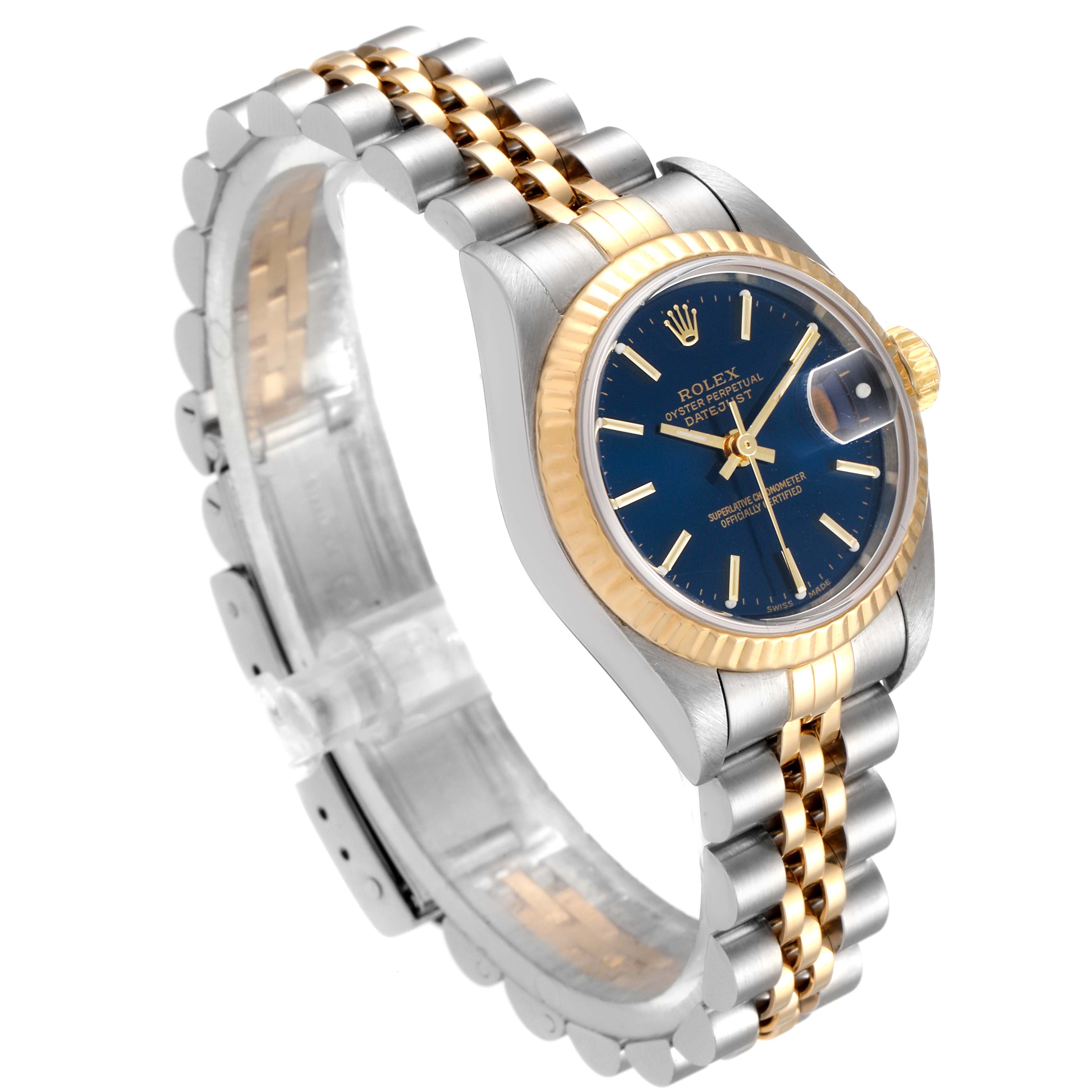 The image shows a Rolex Datejust 79173 Women's Steel and Gold (two tone) Blue Dial 79173 Women's Steel and Gold (two tone) Blue Dial watch at an angle, highlighting its two-tone bracelet, gold bezel, and blue dial.