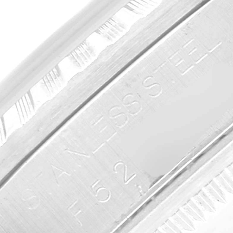 The image shows a close-up of the side of the clasp or bracelet of a Rolex Datejust 16220 Men's Stainless Steel Black Dial 16220 Men's Stainless Steel Black Dial, displaying the "STAINLESS STEEL" engraving.