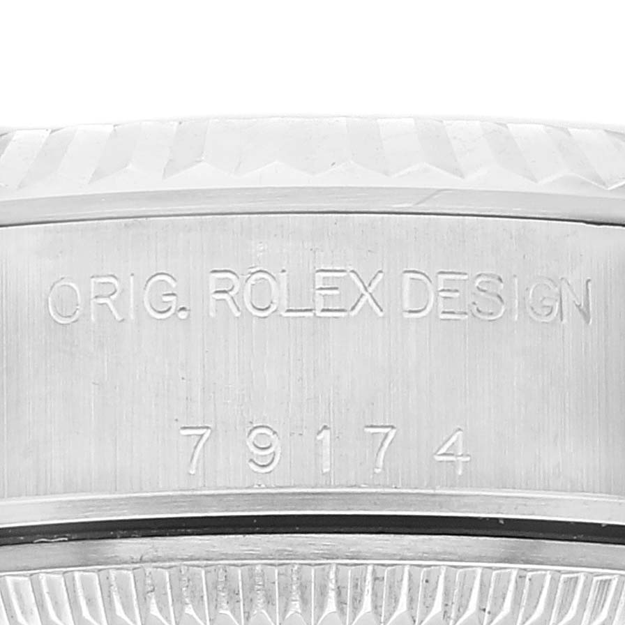 The image shows a close-up of the side of a Rolex Datejust 79174 Women's Stainless Steel Pink Dial 79174 Women's Stainless Steel Pink Dial watch, highlighting its model number and "Orig. Rolex Design" engraving.