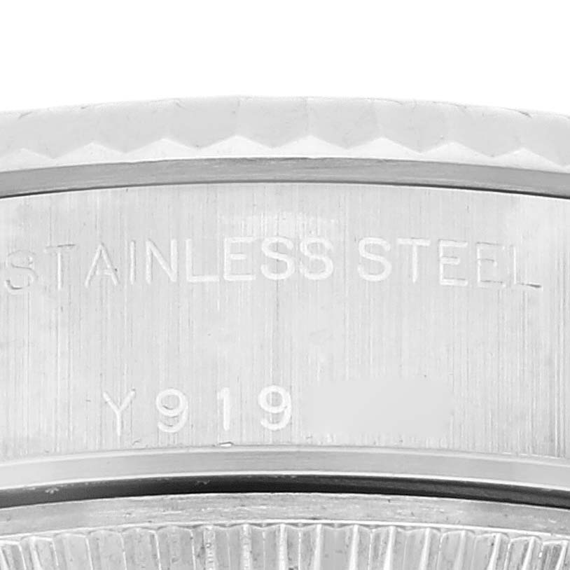 This close-up image shows the engraved stainless steel case back of a Rolex Datejust 79174 Women's Stainless Steel Pink Dial 79174 Women's Stainless Steel Pink Dial watch.
