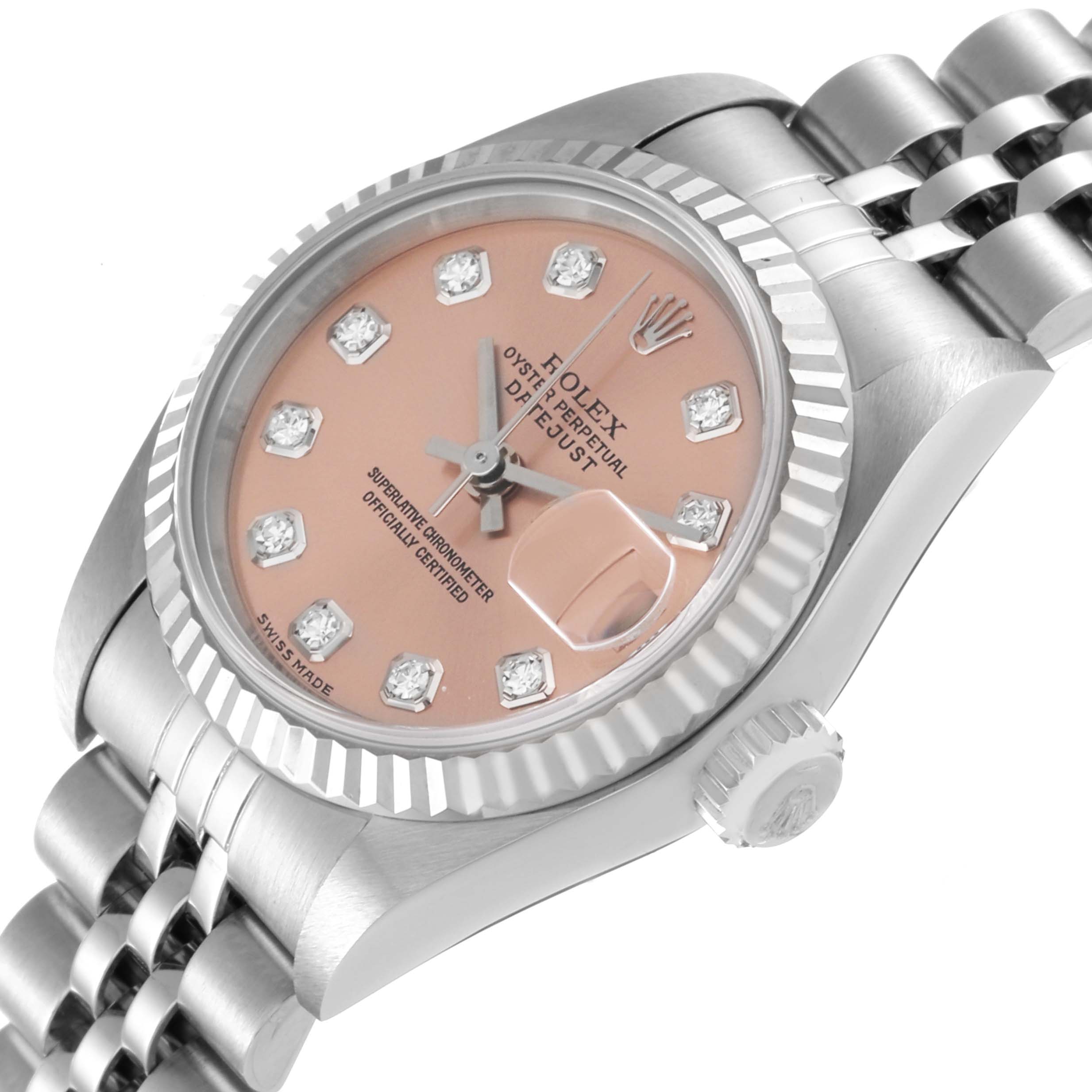 The image shows a close-up of the Rolex Datejust 79174 Women's Stainless Steel Pink Dial 79174 Women's Stainless Steel Pink Dial watch with a pink dial, diamond hour markers, fluted bezel, and Jubilee bracelet.