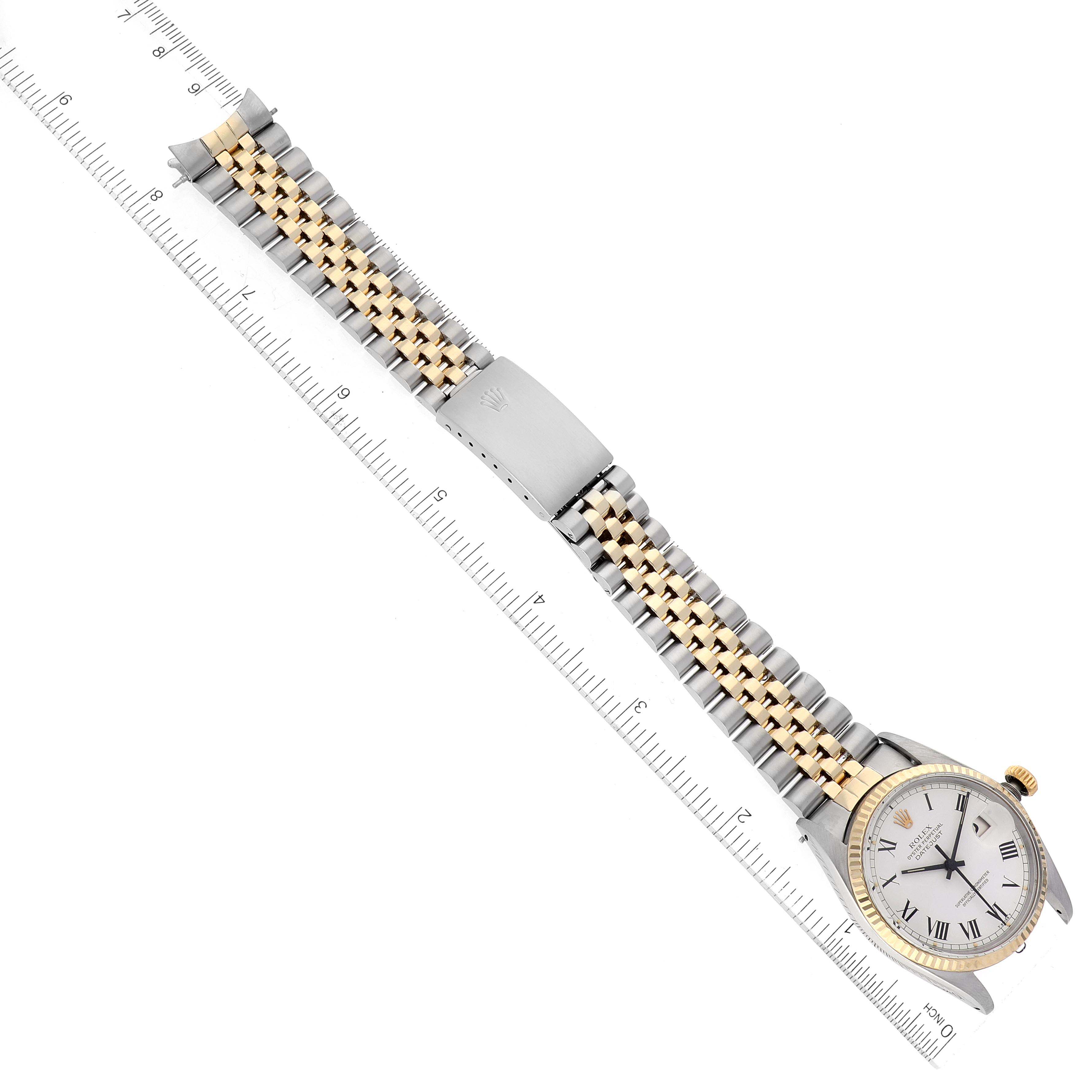 The Vintage Collection Rolex watch is shown from a top-down angle, highlighting the dial, bezel, crown, and two-tone metal strap.