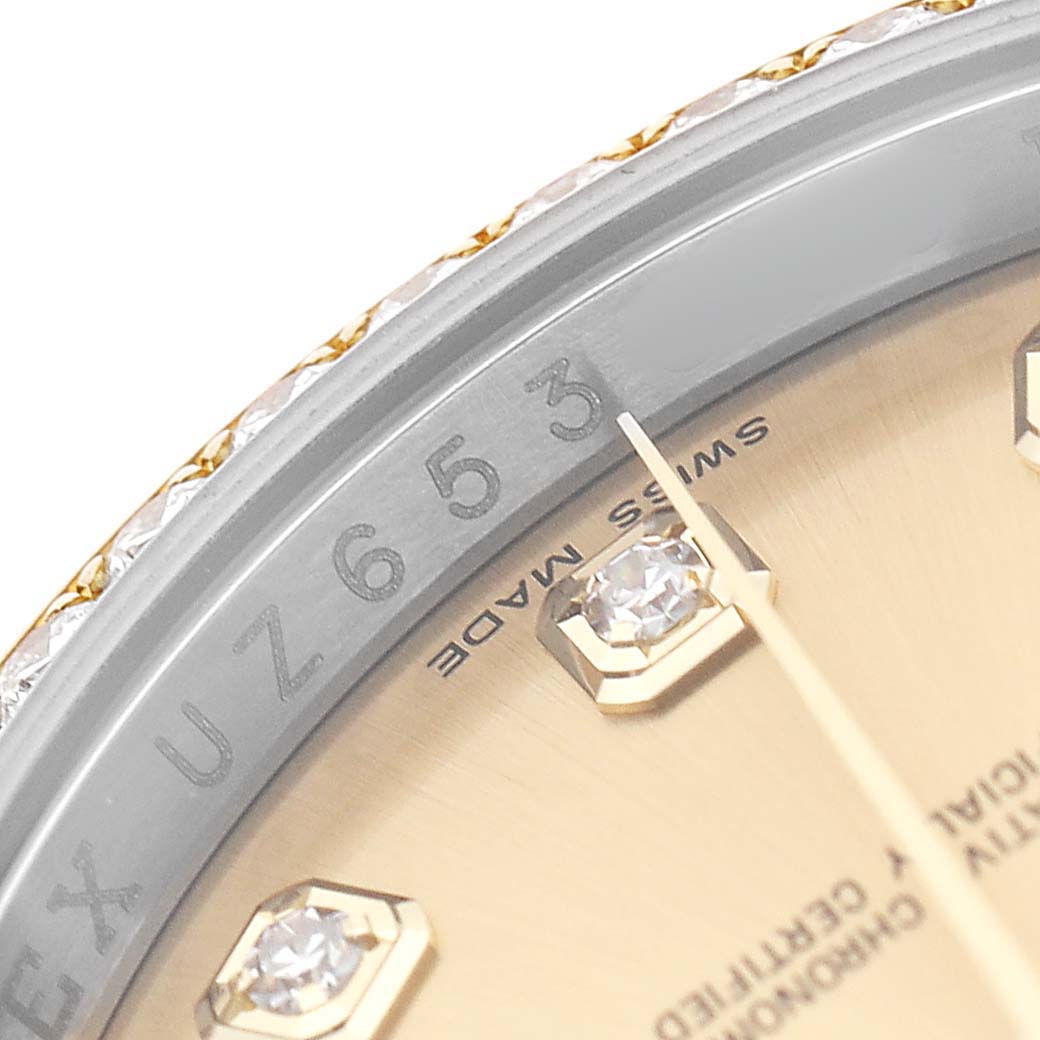 The image shows a close-up of a Rolex Datejust 116243 Men's Steel and Gold (two tone) Champagne Dial watch, focusing on the bezel, partial dial, and diamond indices.