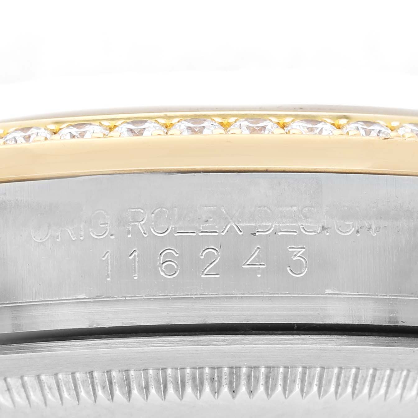 The image shows a close-up of the side of a Rolex Datejust 116243 Men's Steel and Gold (two tone) Champagne Dial, highlighting its engraved serial number and part of the bezel.