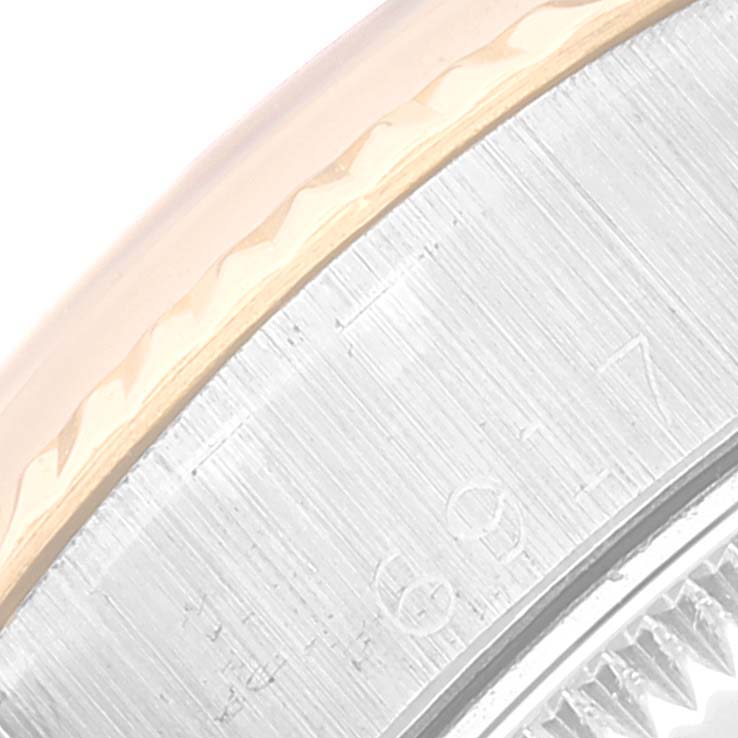 This image shows a close-up of the bezel and part of the case of a Rolex Datejust 6917 Women's Steel and Gold (two tone) Champagne Dial 6917 Women's Steel and Gold (two tone) Champagne Dial watch.