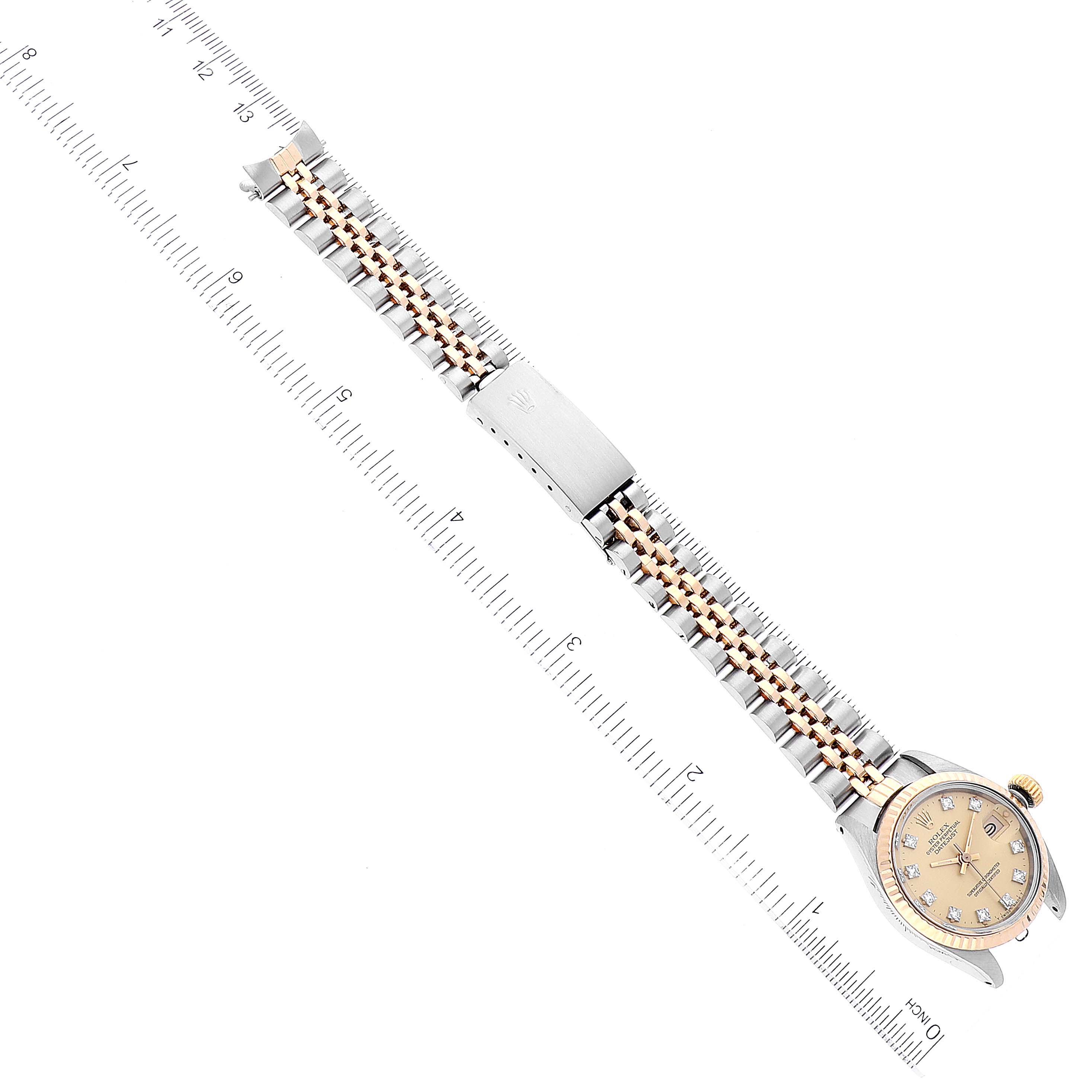 The image shows a top view of a Rolex Datejust 6917 Women's Steel and Gold (two tone) Champagne Dial 6917 Women's Steel and Gold (two tone) Champagne Dial watch, highlighting its bracelet, clasp, and face.
