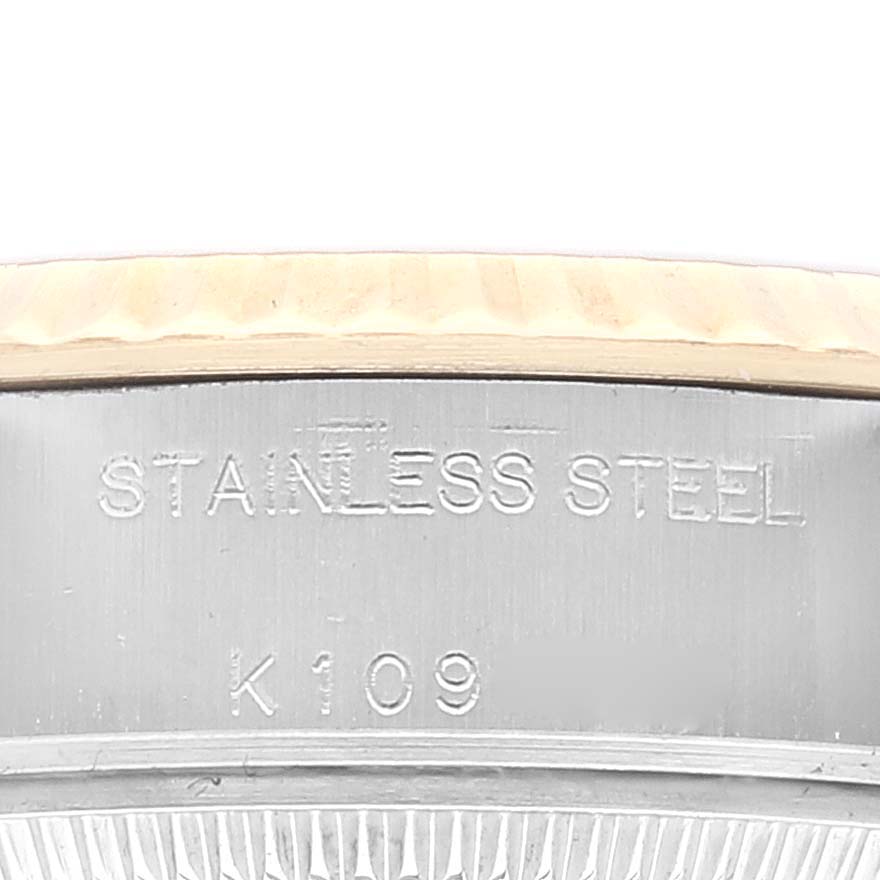 This image shows a close-up of the stainless steel casing on a Rolex Datejust 79173 Women's Steel and Gold (two tone) Champagne Dial 79173 Women's Steel and Gold (two tone) Champagne Dial watch, highlighting the material engraving.