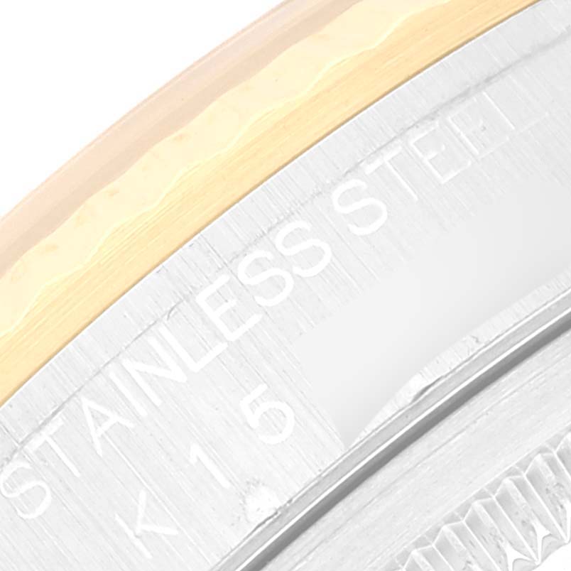 This close-up shows the "Stainless Steel" engraving on the side of a Rolex Datejust 16233 Men's Steel and Gold (two tone) White Dial 16233 Men's Steel and Gold (two tone) White Dial watch case.