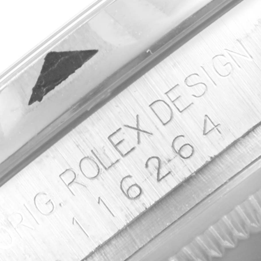 The image shows a close-up of the side engraving on a Rolex Turn-o-Graph 116264 Men's Stainless Steel Black Dial 116264 Men's Stainless Steel Black Dial watch case.
