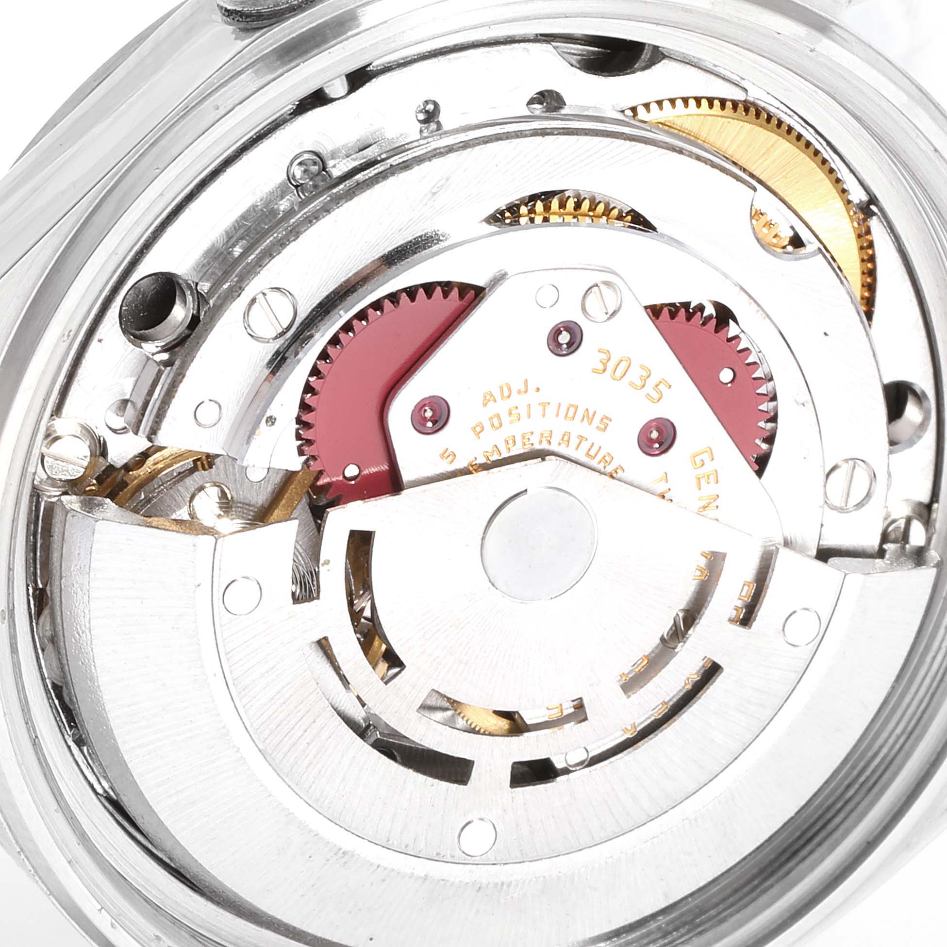 The image shows an internal view of the Rolex Vintage Collection 16014 Men's Stainless Steel Grey Dial 16014 Men's Stainless Steel Grey Dial watch, highlighting its intricate movement mechanism.