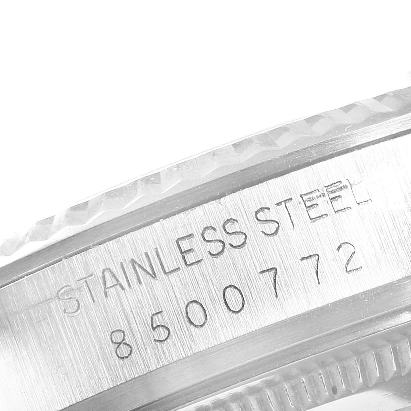 The image shows a close-up of the side of the case of a Rolex Vintage Collection 16014 Men's Stainless Steel Grey Dial 16014 Men's Stainless Steel Grey Dial watch, displaying the stainless steel material and serial number.