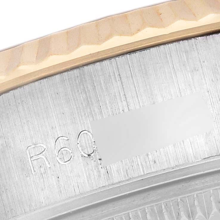 The image shows a close-up of the case and part of the fluted bezel of a Rolex Datejust 69173 Women's Steel and Gold (two tone) White Dial 69173 Women's Steel and Gold (two tone) White Dial watch.
