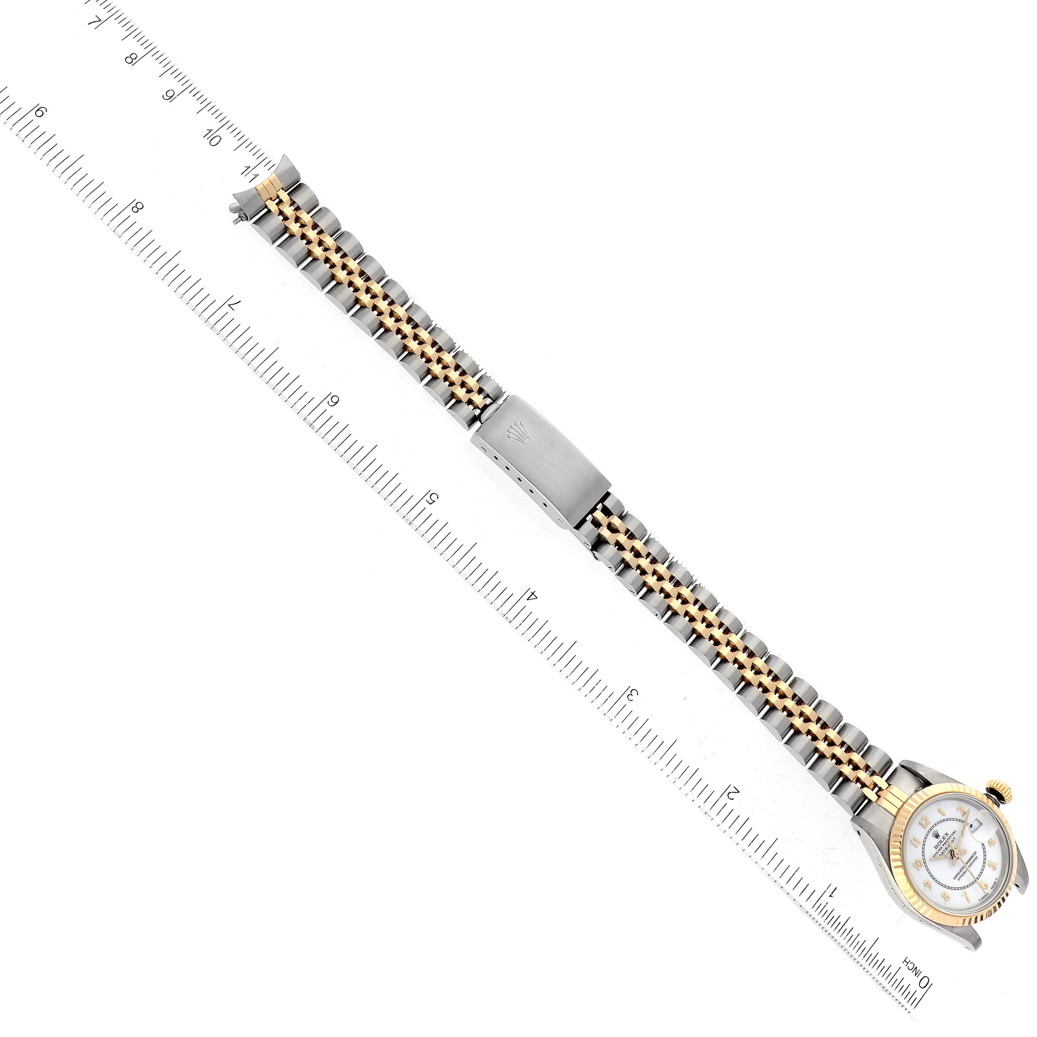 The Rolex Datejust 69173 Women's Steel and Gold (two tone) White Dial 69173 Women's Steel and Gold (two tone) White Dial model watch is shown from a top-down angle, displaying its face, case, and stainless steel and gold Jubilee bracelet.