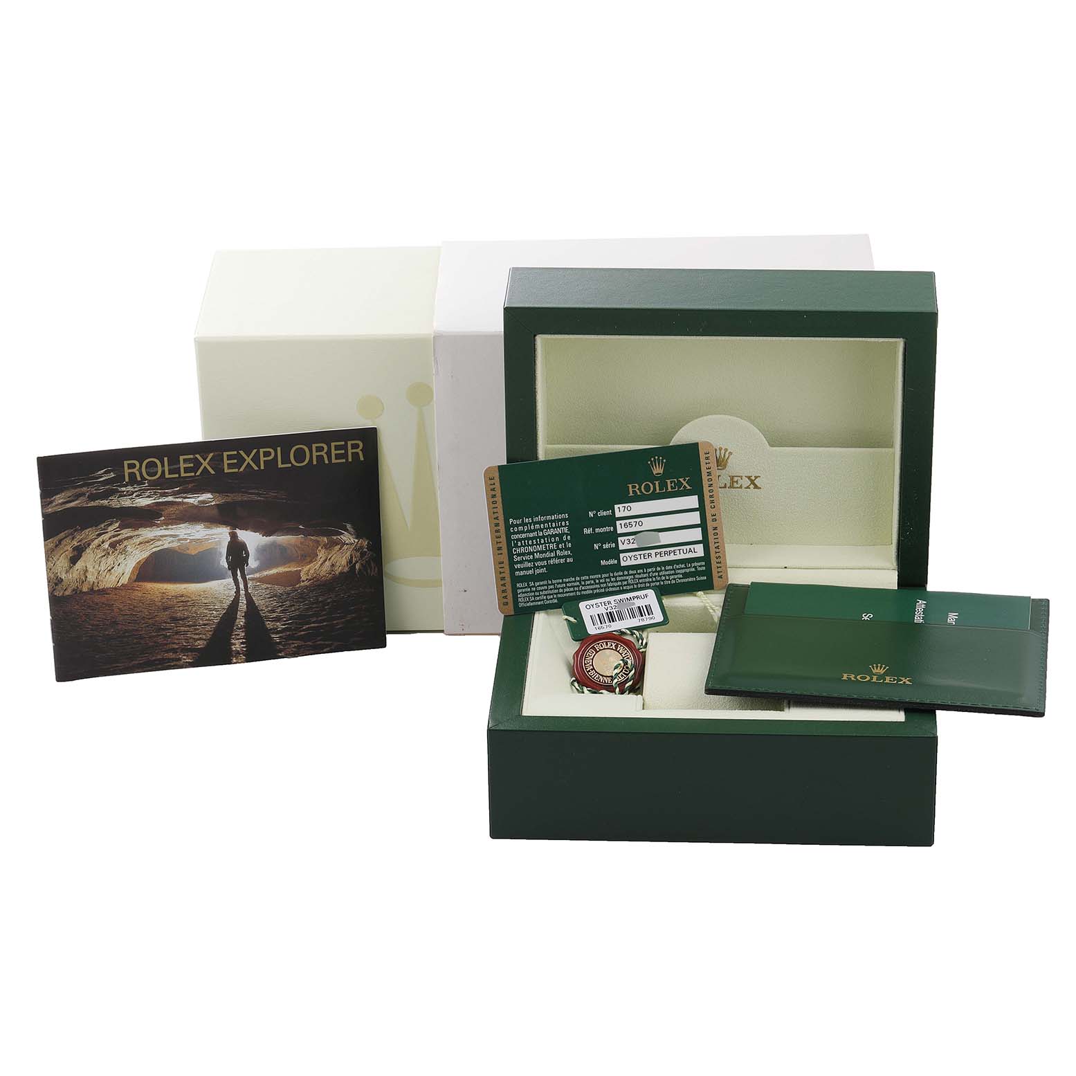 The image shows a Rolex Explorer 16570 Men
s Stainless Steel White Dial 16570 Men
s Stainless Steel White Dial watch packaging, including a box, card, tags, and booklet, viewed from an overhead angle.