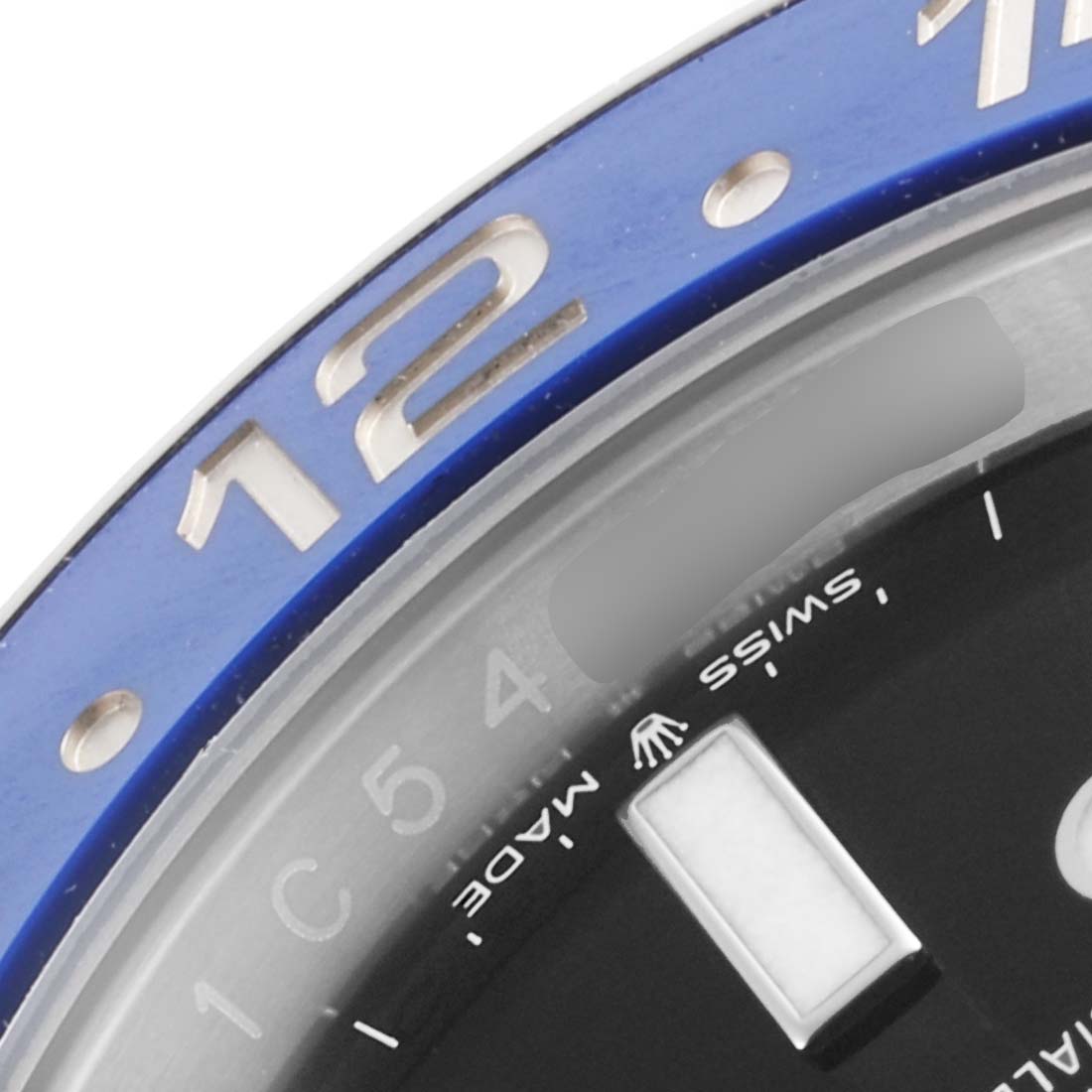 This image shows a close-up of the bezel and a portion of the dial of a Rolex GMT-Master 126710 Men
s Stainless Steel Black Dial 126710 Men
s Stainless Steel Black Dial watch.