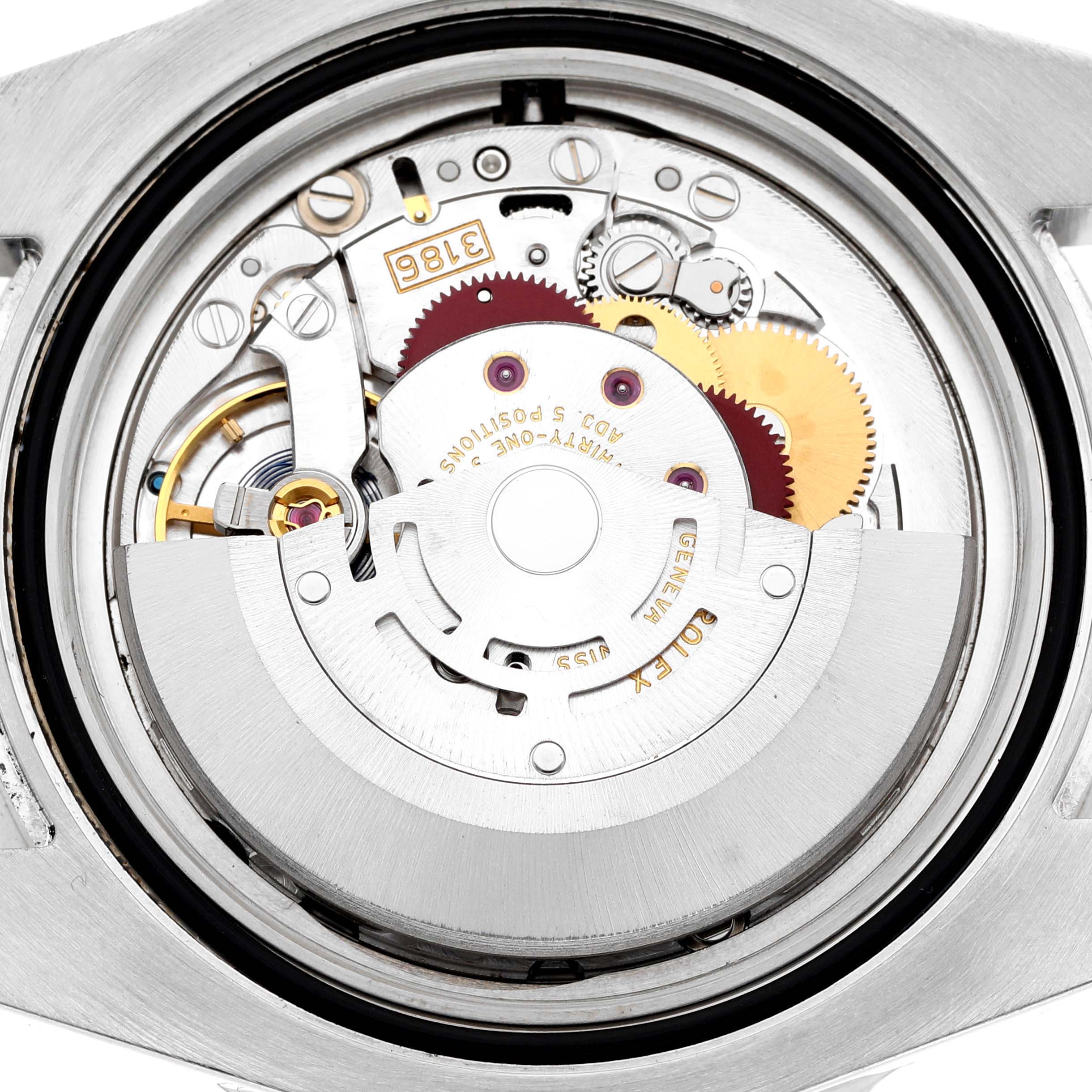 This image shows the back view of a Rolex GMT-Master 116710LN Men's Stainless Steel Black Dial, revealing its intricate movement and gears.