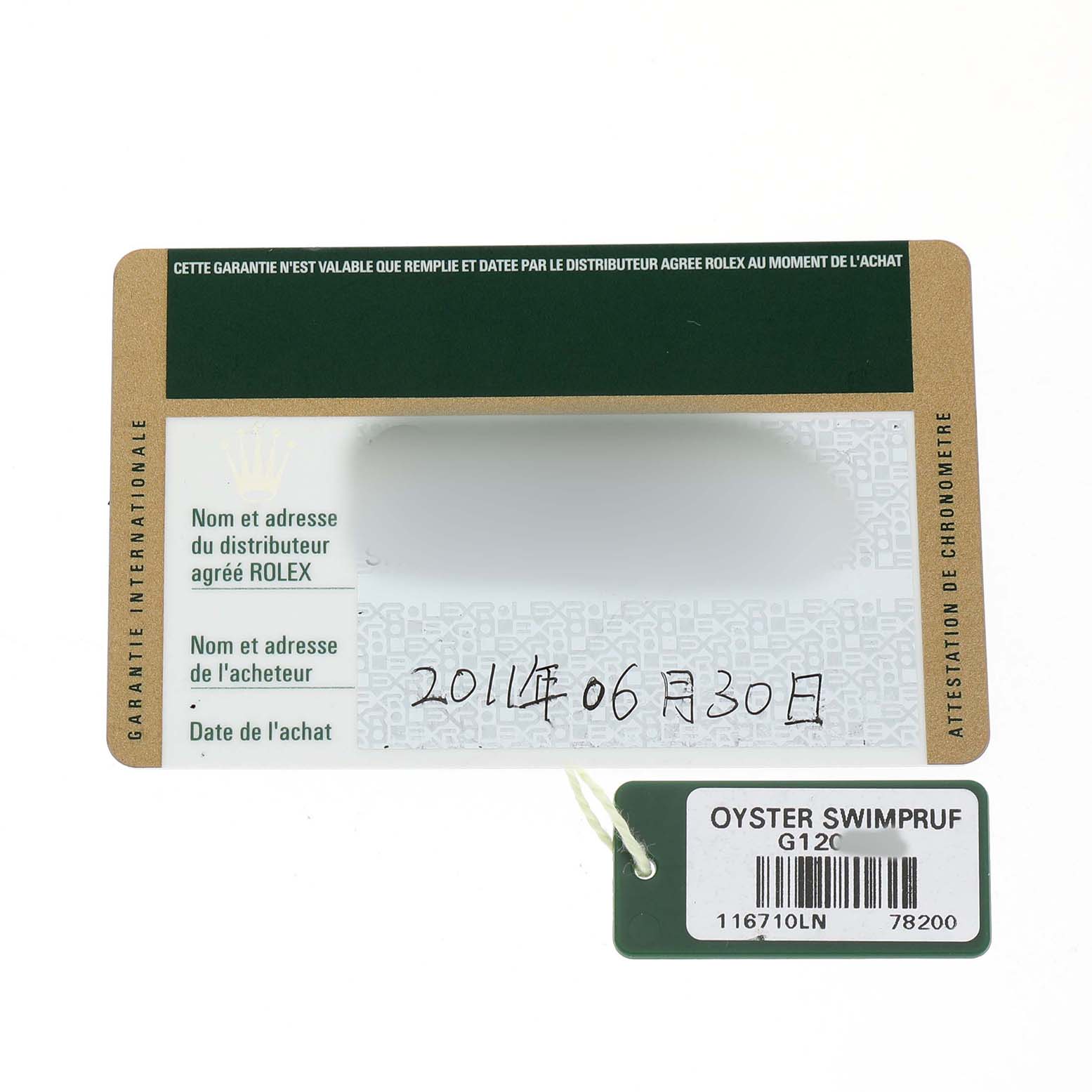 The image shows an authentication card and a tag for the Rolex GMT-Master 116710LN Men's Stainless Steel Black Dial watch, viewed from above.