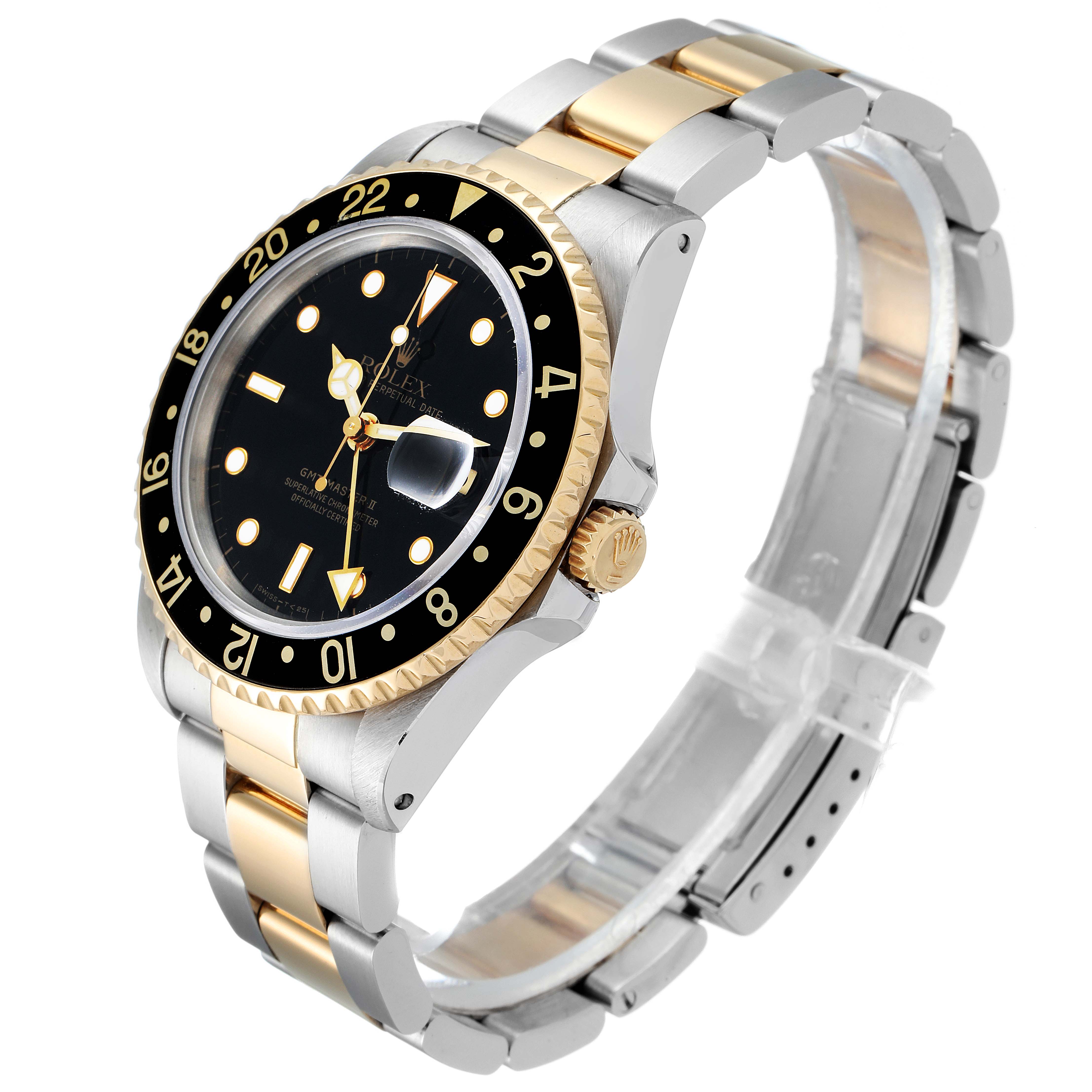 The Rolex GMT-Master 16713 Men's Steel and Gold (two tone) Black Dial 16713 Men's Steel and Gold (two tone) Black Dial watch is displayed at a three-quarter angle, showcasing the face, bezel, crown, and part of the bracelet.
