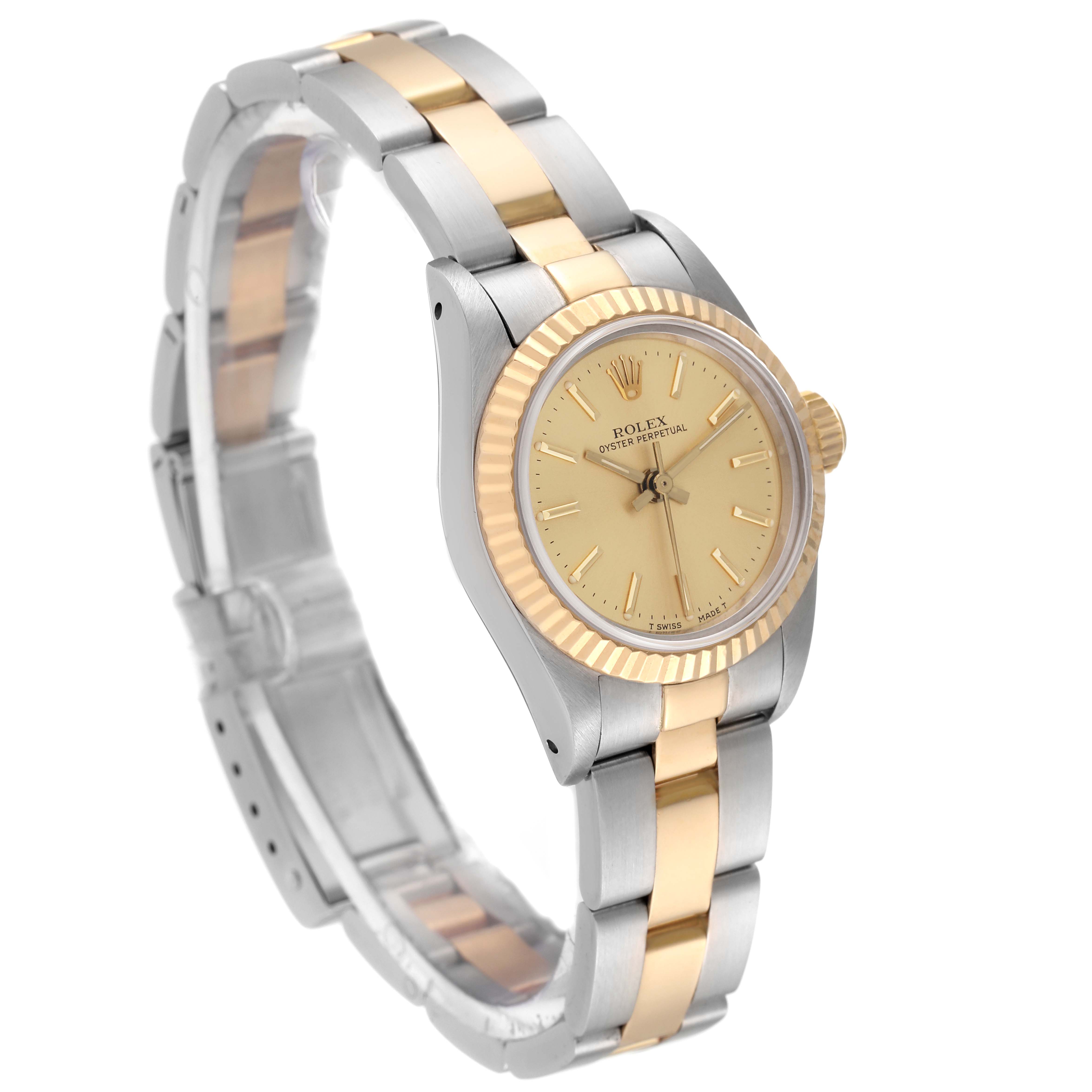 The Rolex Oyster Perpetual 67193 Women's Steel and Gold (two tone) Champagne Dial 67193 Women's Steel and Gold (two tone) Champagne Dial watch is shown at a three-quarter angle, displaying the face, bezel, and part of the bracelet.
