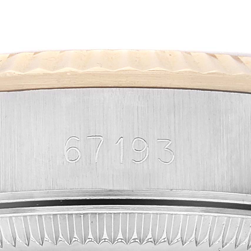 This image features a close-up angle showing the side case and bezel of a Rolex Oyster Perpetual 67193 Women's Steel and Gold (two tone) Champagne Dial 67193 Women's Steel and Gold (two tone) Champagne Dial model, displaying the engraved number 67193.