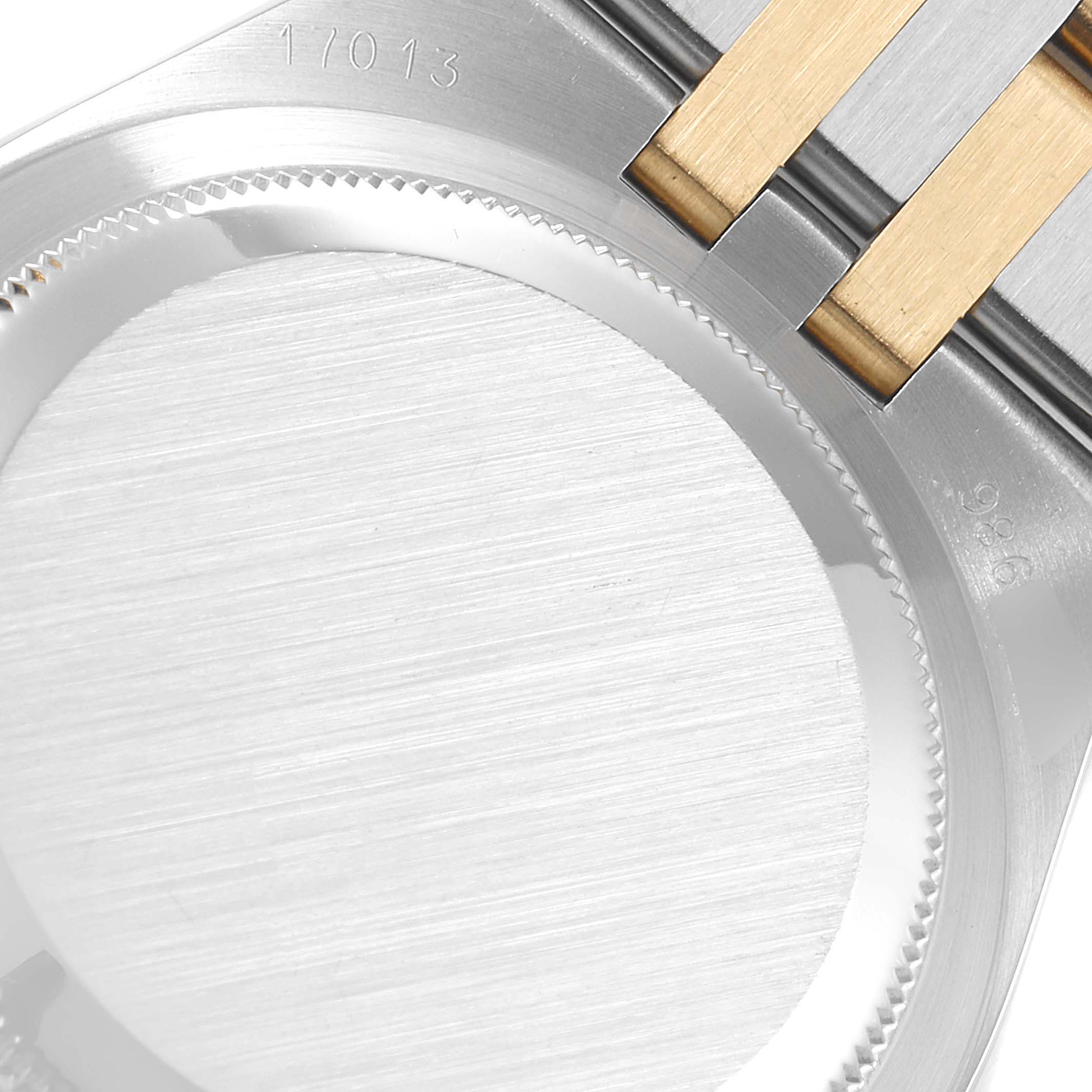 The image shows the case back and a section of the bracelet of the Rolex Oysterquartz 17013 Men's Steel and Gold (two tone) Champagne Dial 17013 Men's Steel and Gold (two tone) Champagne Dial with model number 17013.