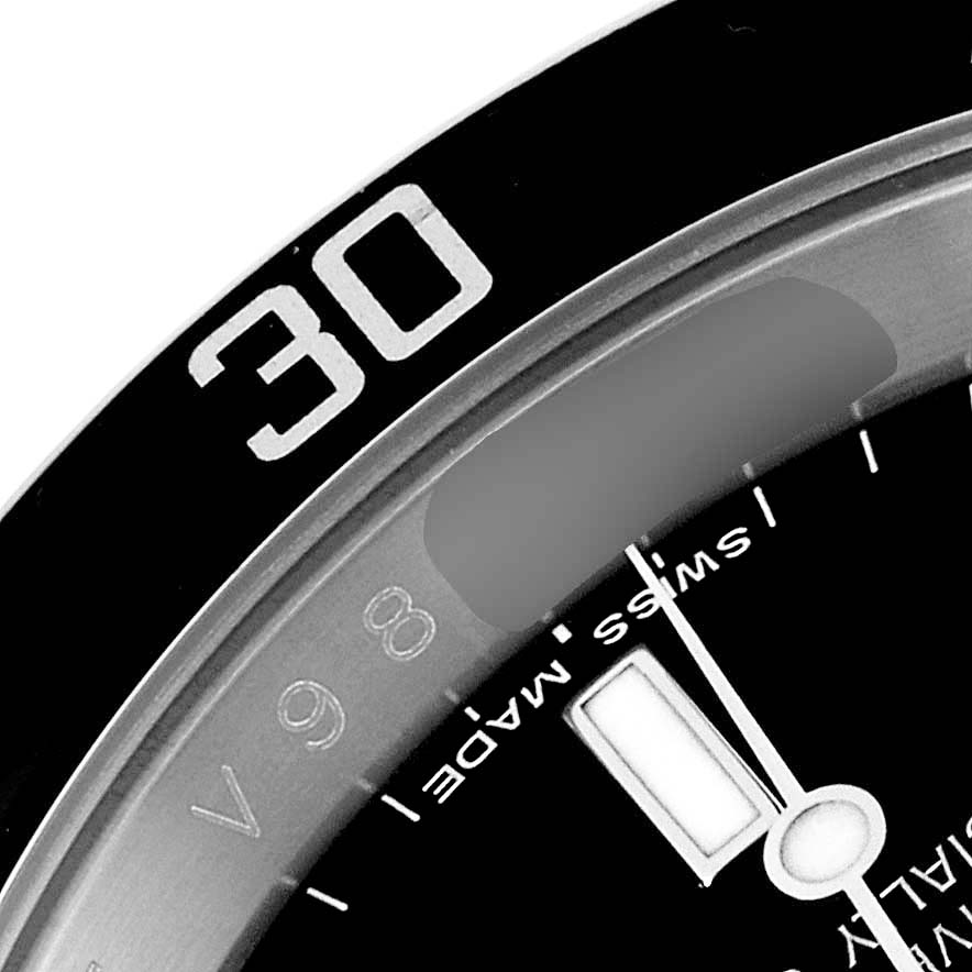 The image shows a close-up of the bezel and part of the dial on a Rolex Submariner 16610 Men
s Stainless Steel Black Dial 16610 Men
s Stainless Steel Black Dial.