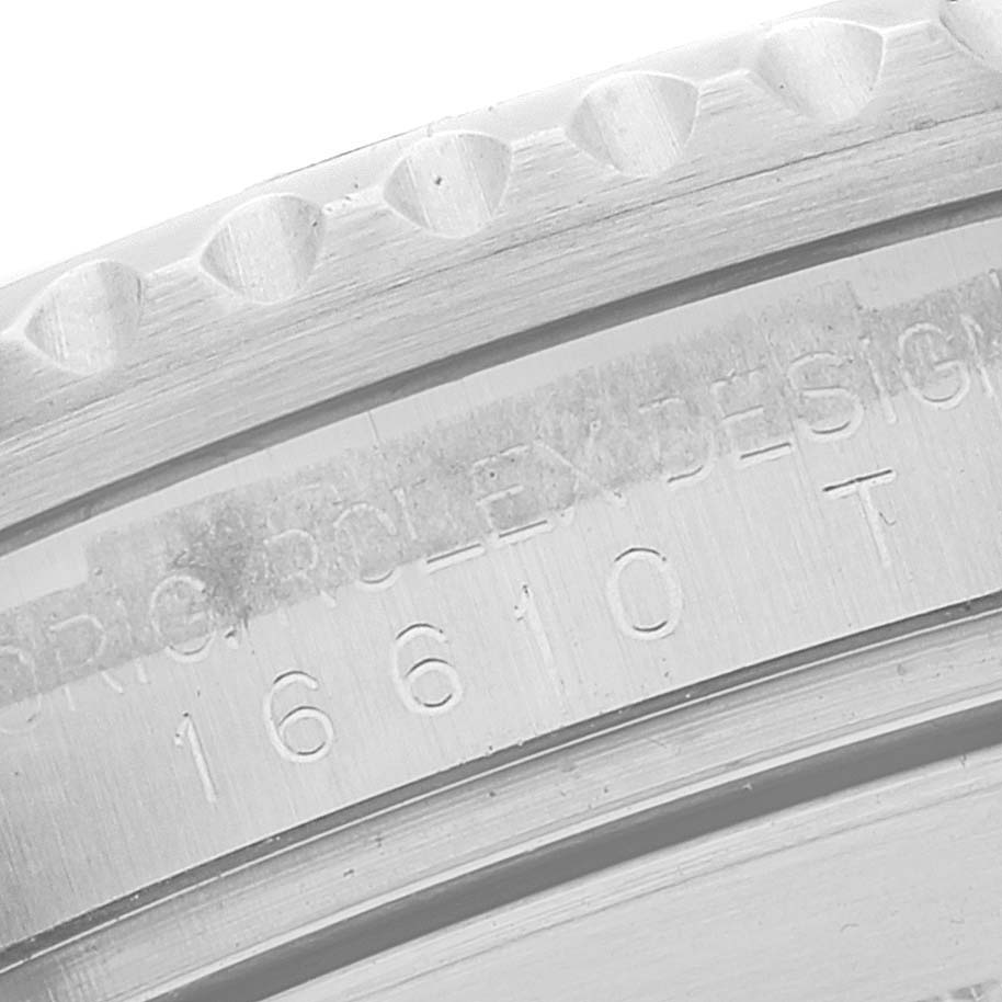 This image shows a close-up of the bezel edge and the engraved case side, displaying the model number of a Rolex Submariner 16610 Men
s Stainless Steel Black Dial 16610 Men
s Stainless Steel Black Dial watch.